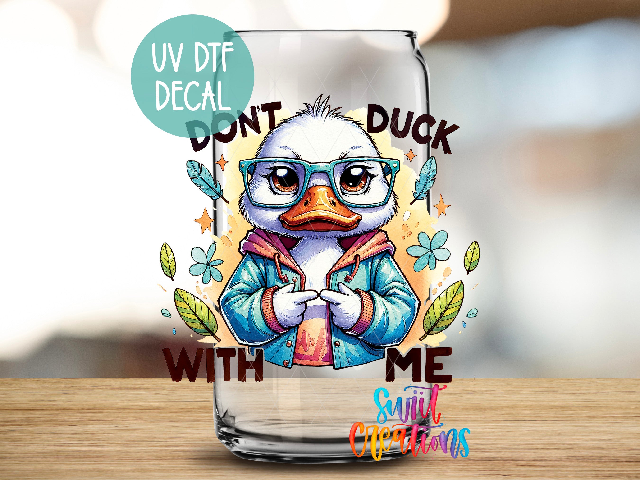 A cartoon duck wearing glasses and a jacket, with the text "DON'T DUCK WITH ME" and "Suitcase Creations" printed on it.