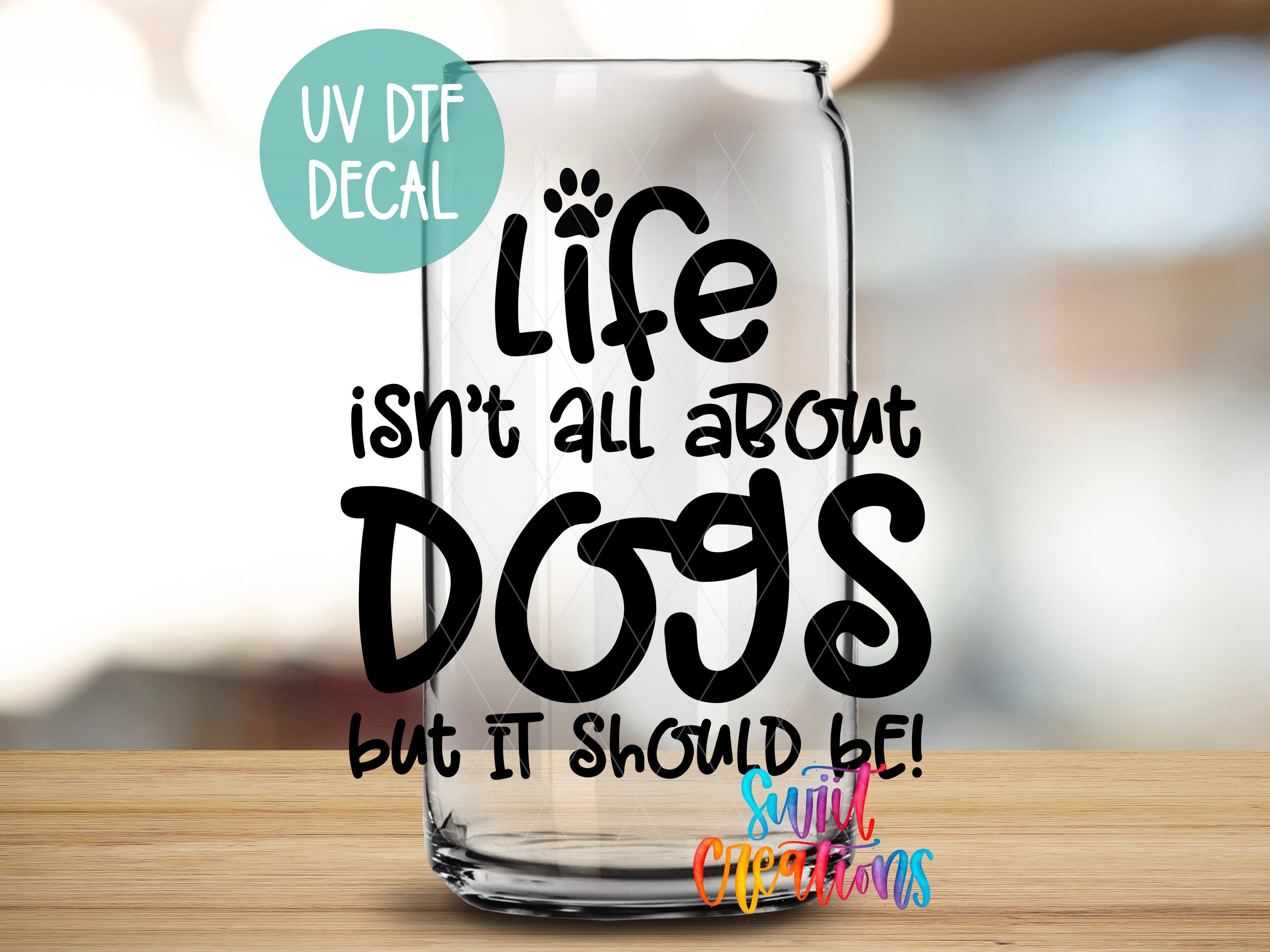 a glass with the words life isn't all about dogs but it should be