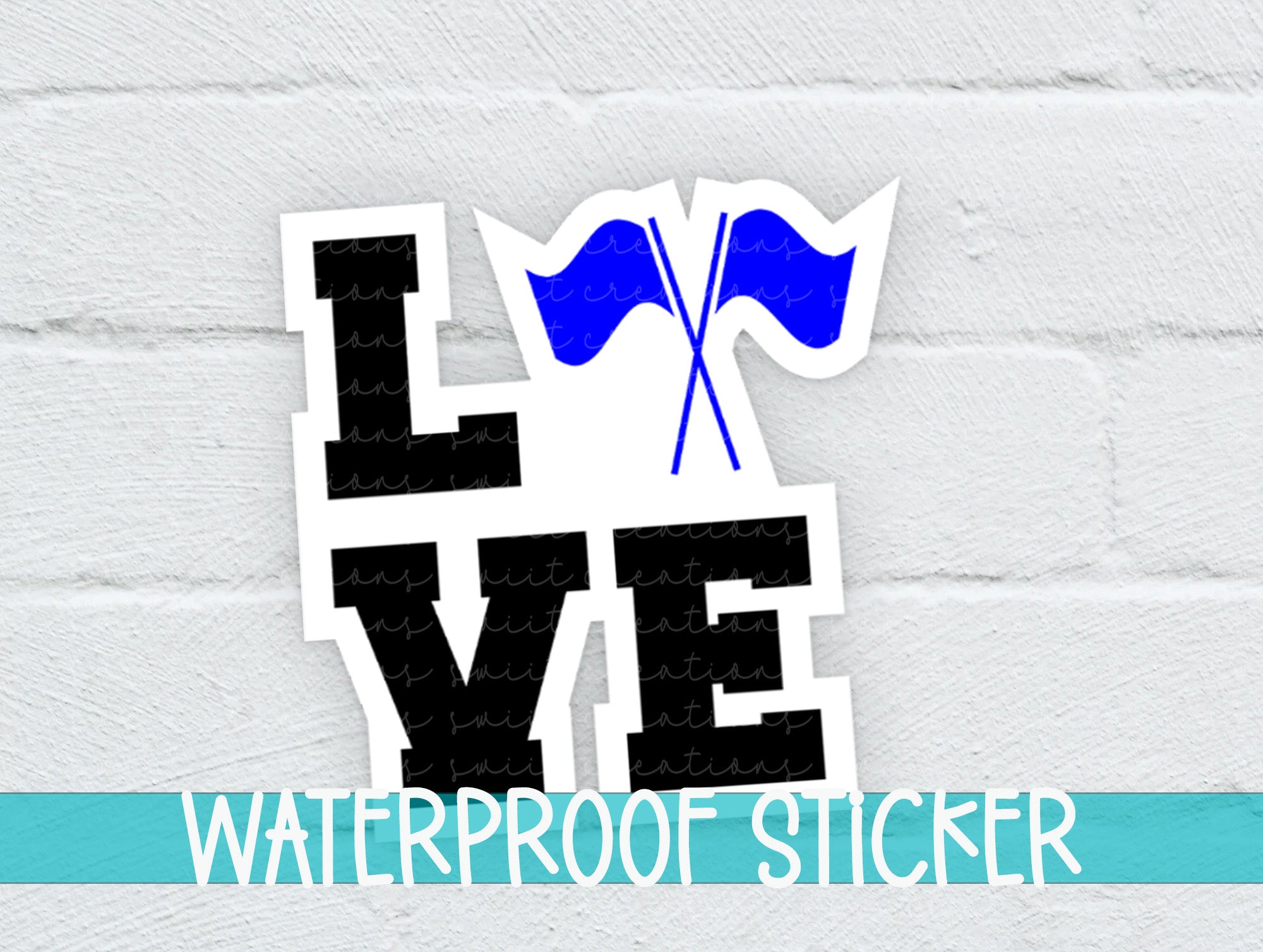 a white brick wall with a blue and black sticker on it