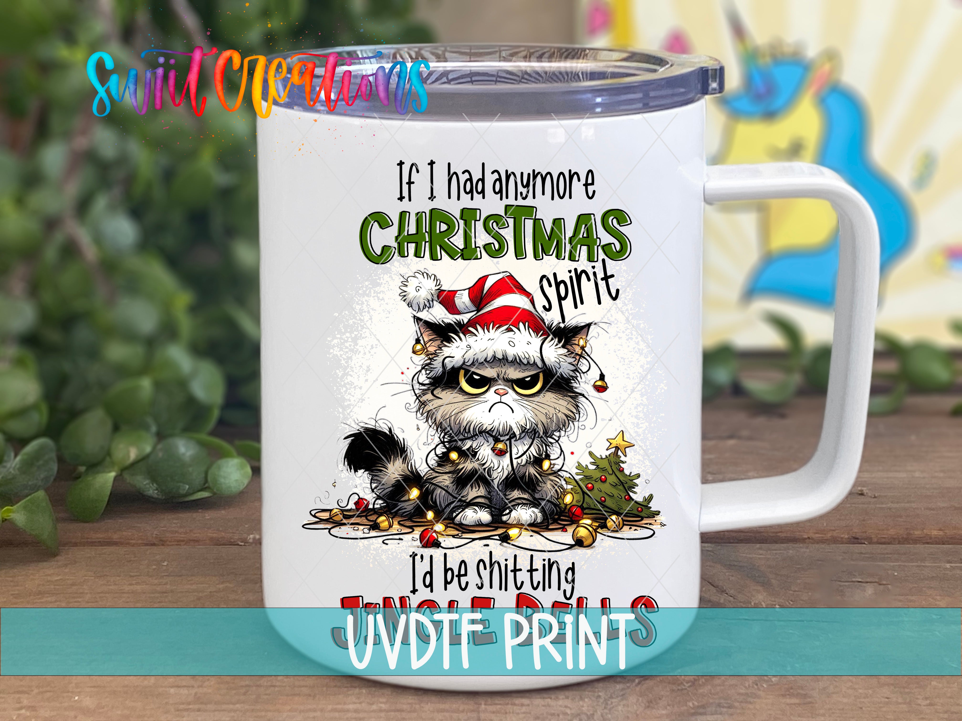 A white mug with a cartoon image of a cat wearing a Santa hat and Christmas decorations, along with text that says "If I had any more Christmas spirit, I'd be shitting jungle rats".