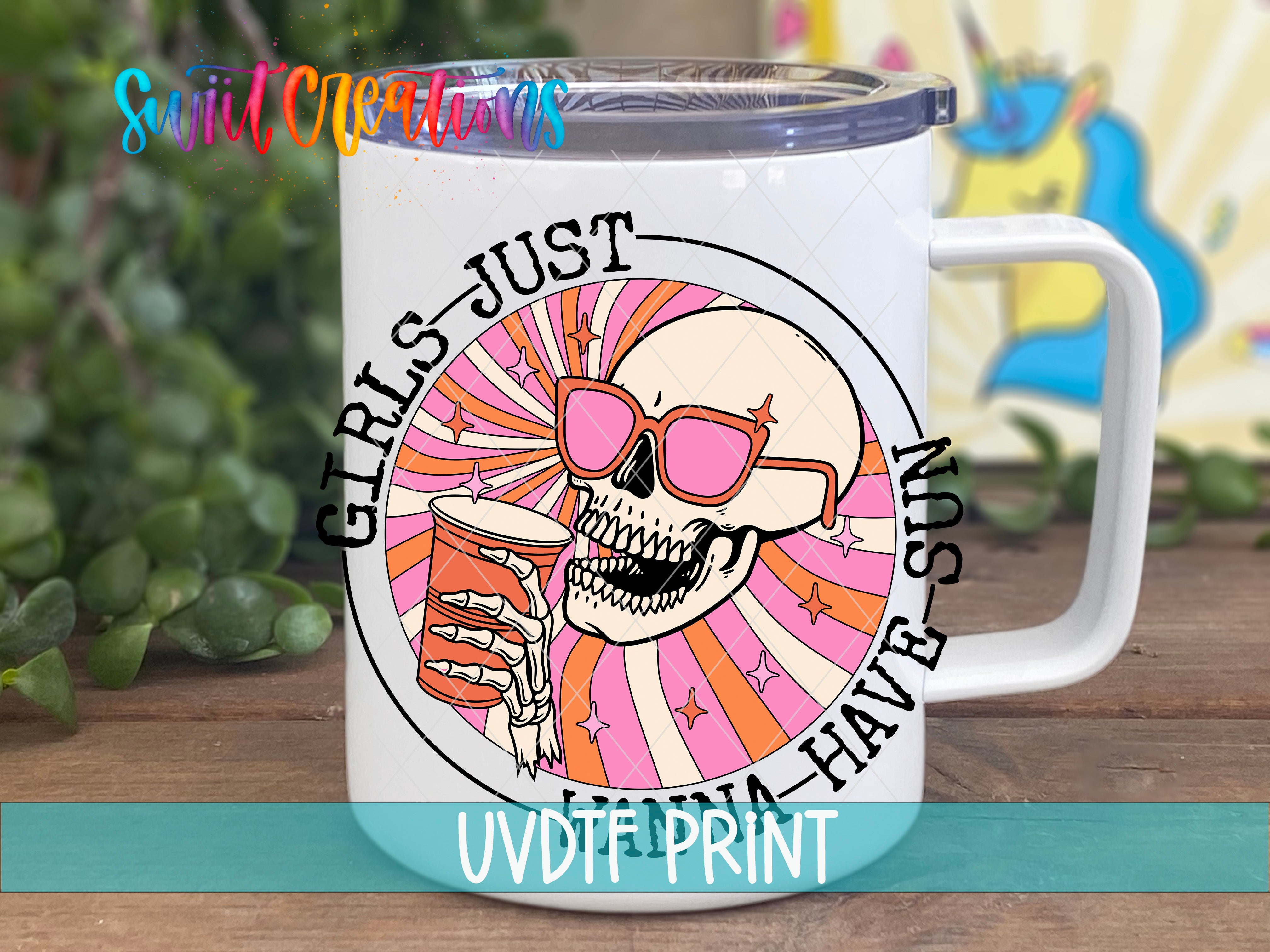 A white mug with a colorful design featuring a skull wearing sunglasses and holding a drink, surrounded by a rainbow-colored spiral pattern.