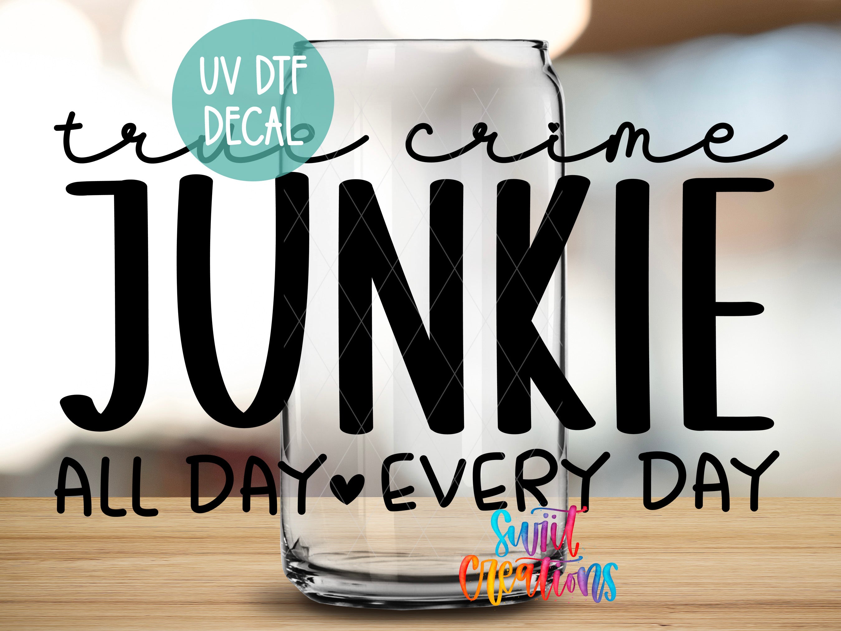 a glass with the text "JUNKIE" written on it, along with the phrase "All day every day" below it.