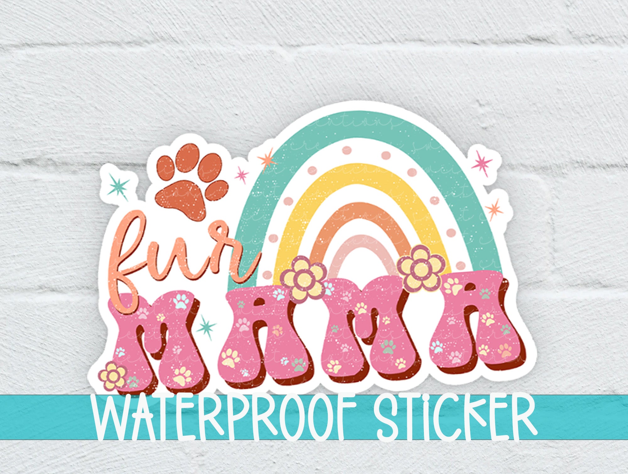 a waterproof sticker with a rainbow and paw prints