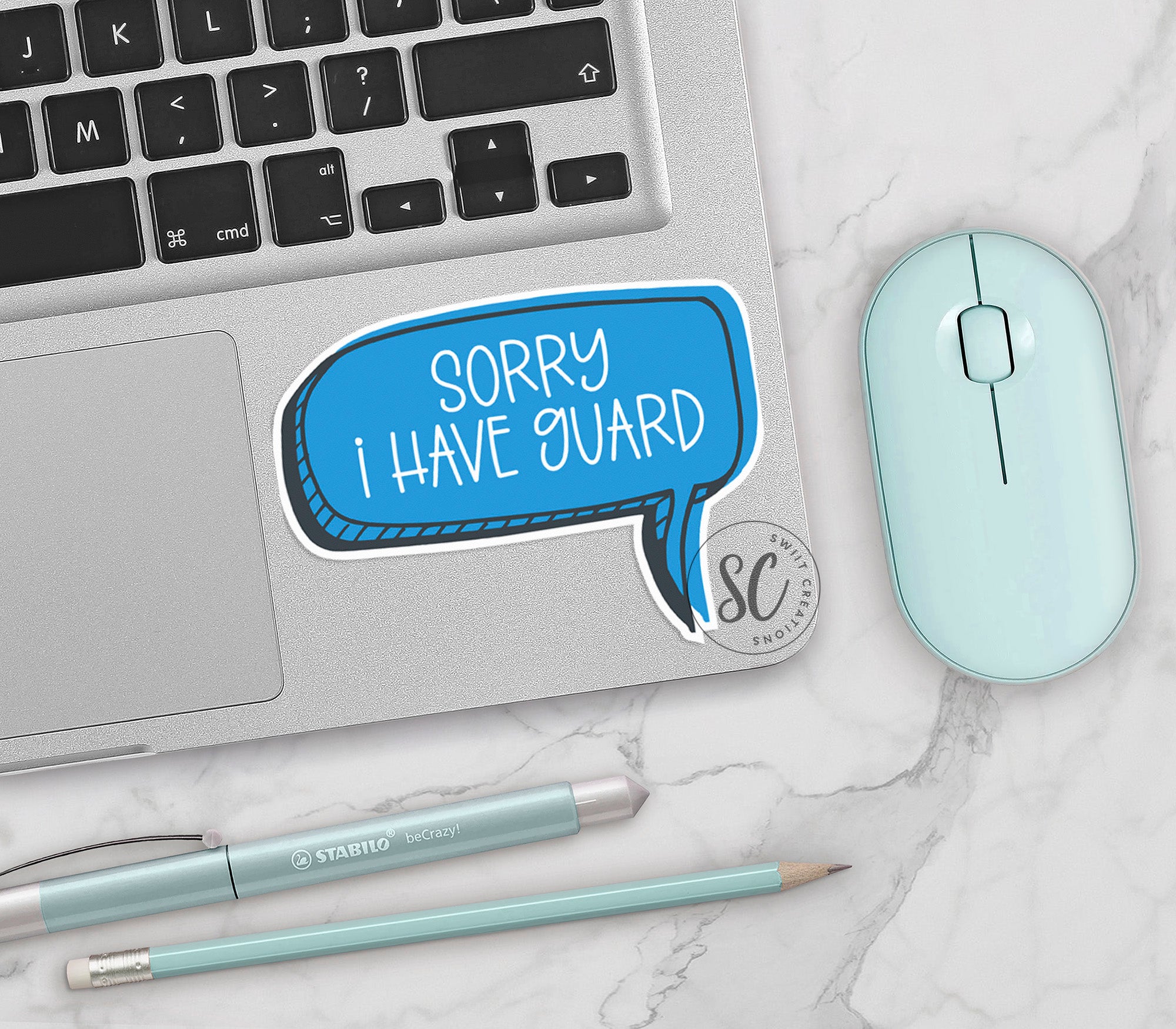 a laptop with a speech bubble sticker on it