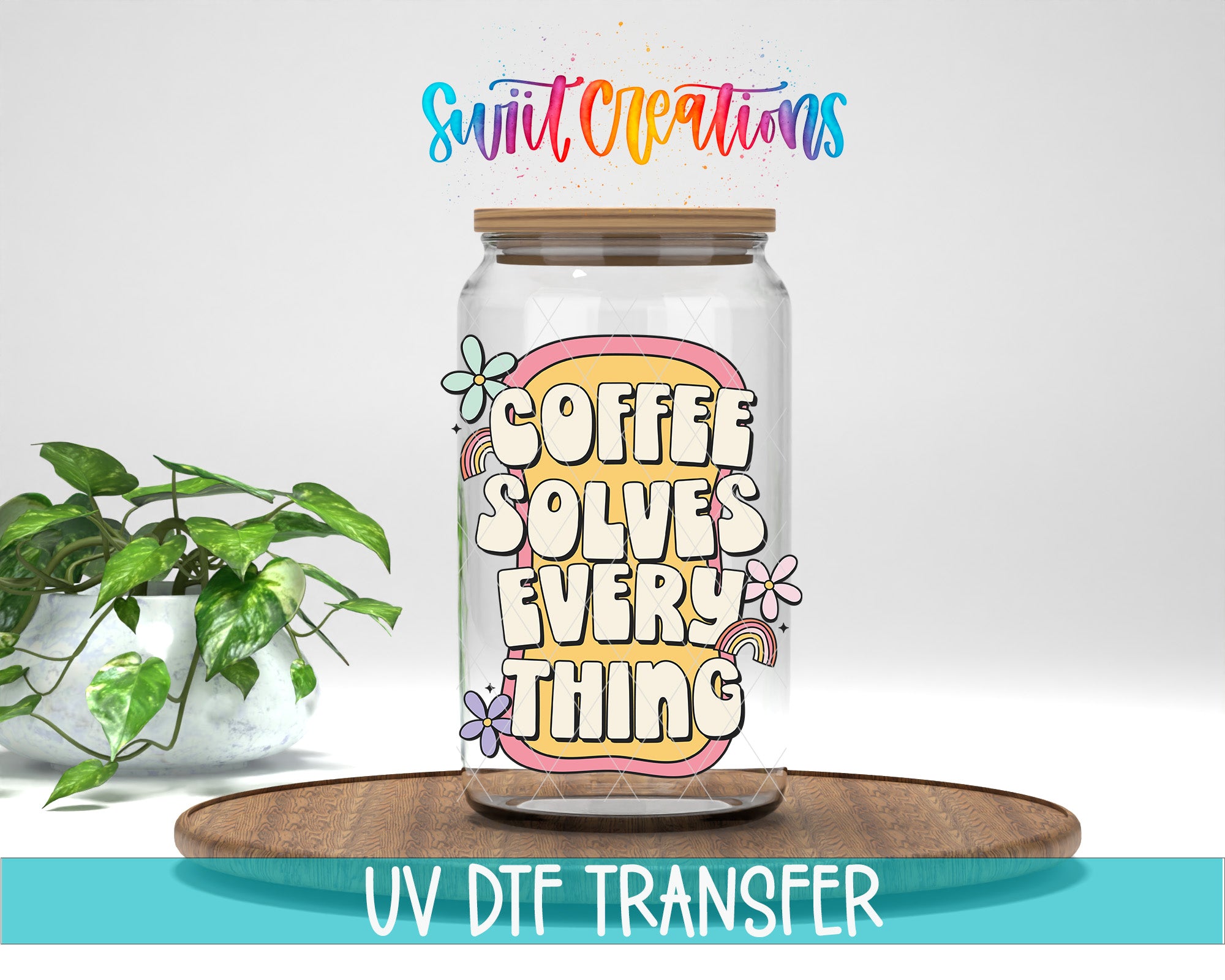 a glass jar with a colorful and whimsical design, including the text "COFFEE SOLVES EVERY THING" and illustrations of flowers and rainbows. The jar is placed on a wooden surface, and there is a potted plant in the background.