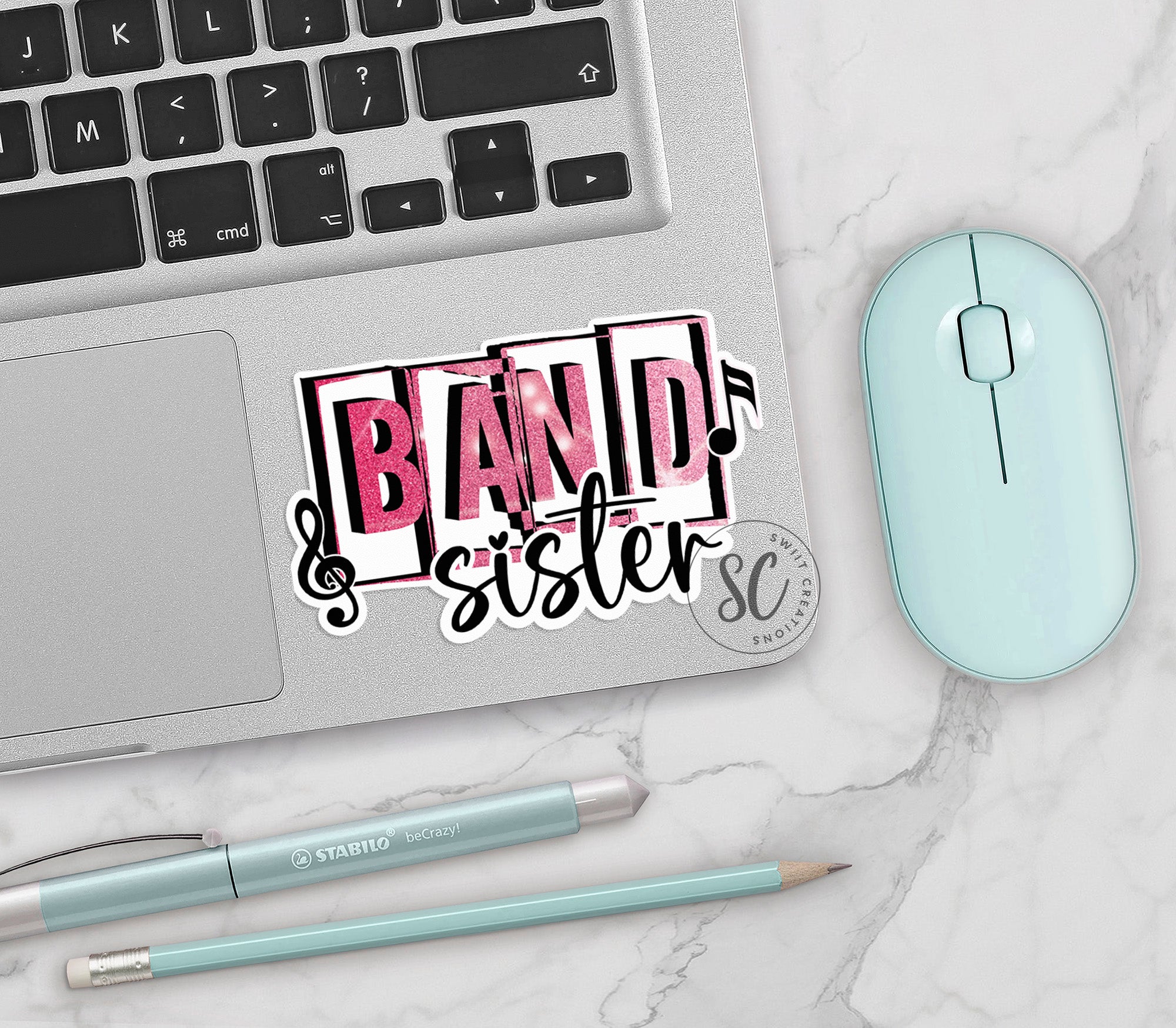 a laptop computer sitting on top of a white table