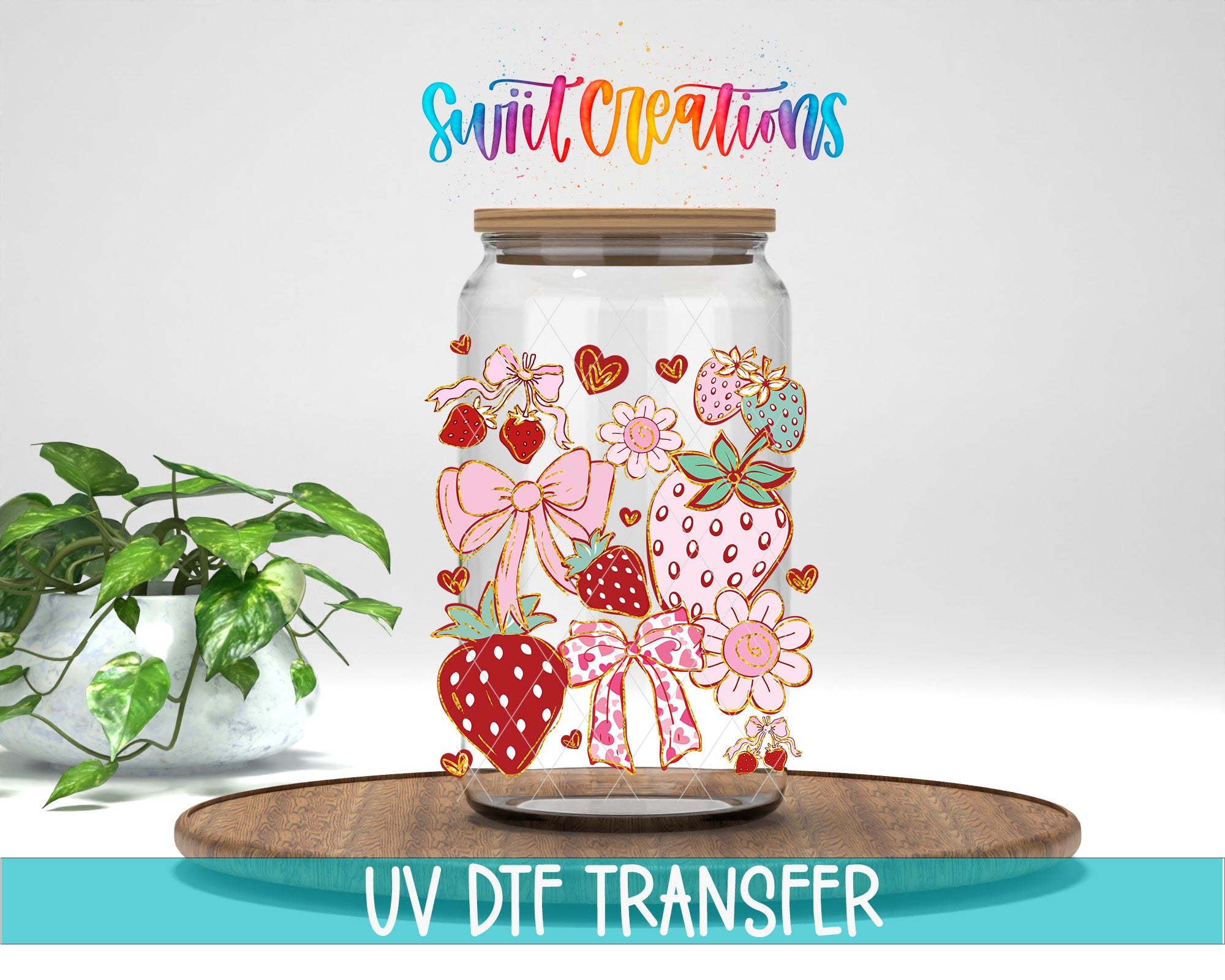 a glass jar with a colorful design of strawberries, flowers, and bows, placed on a wooden surface.