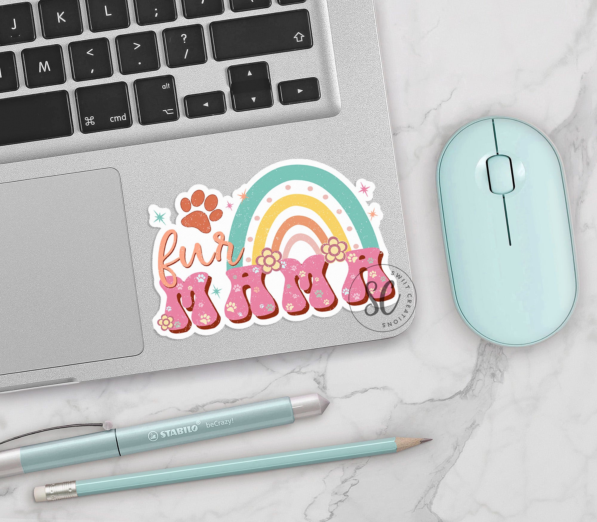 a laptop computer sitting next to a mouse and keyboard