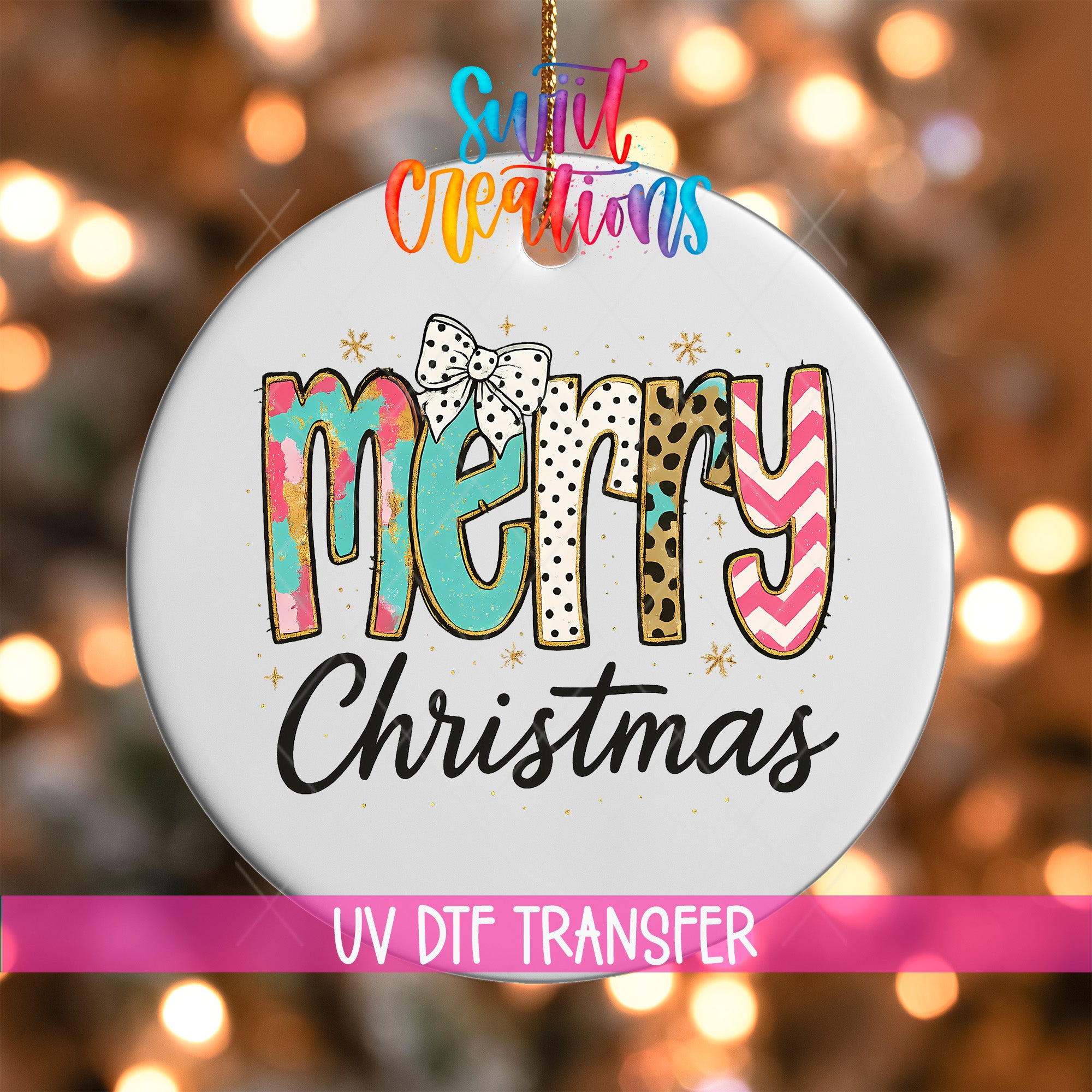 A white ornament with the text "Merry Christmas" in a colorful, stylized font.