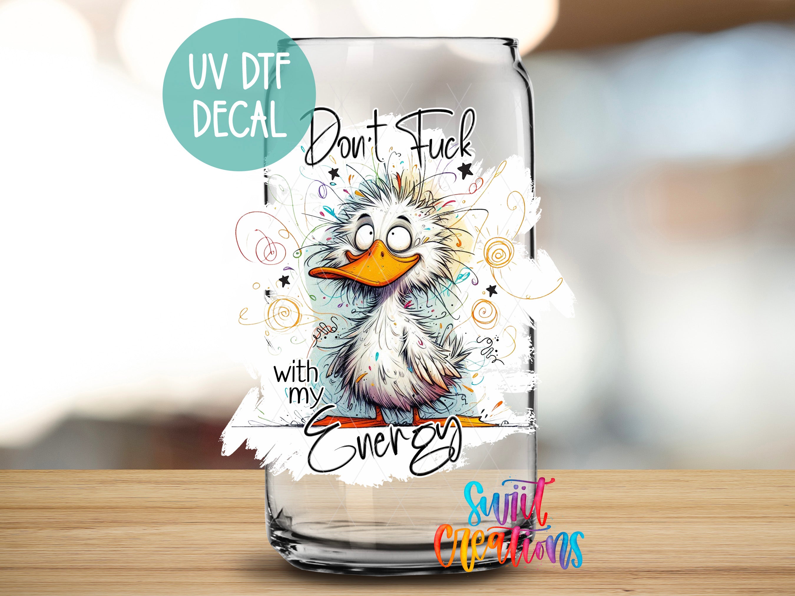 a glass with a picture of a bird on it