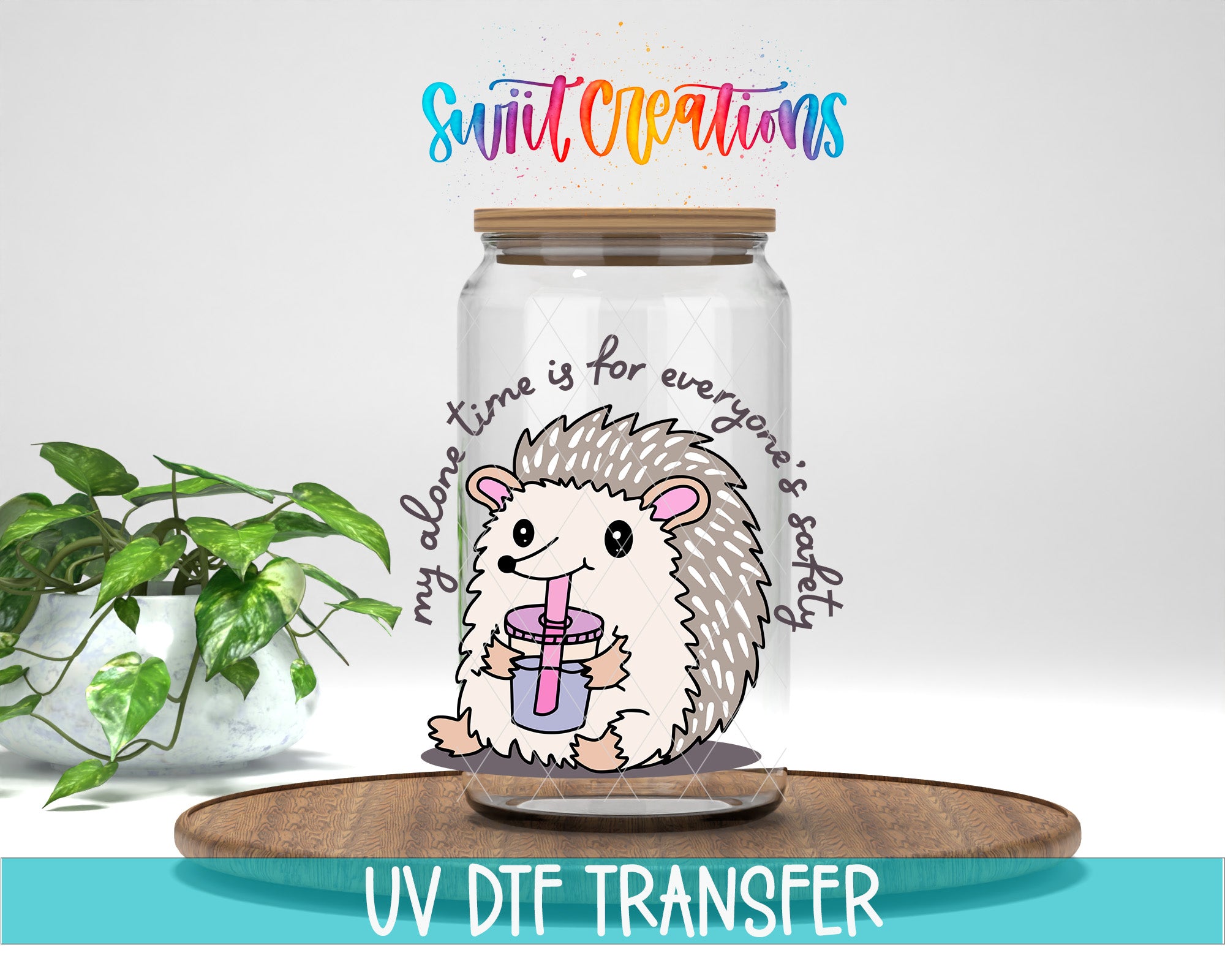A glass jar with a hedgehog inside, holding a drink, and surrounded by colorful text that says "Swift Creations" and "my alone time is for everyone's safety".