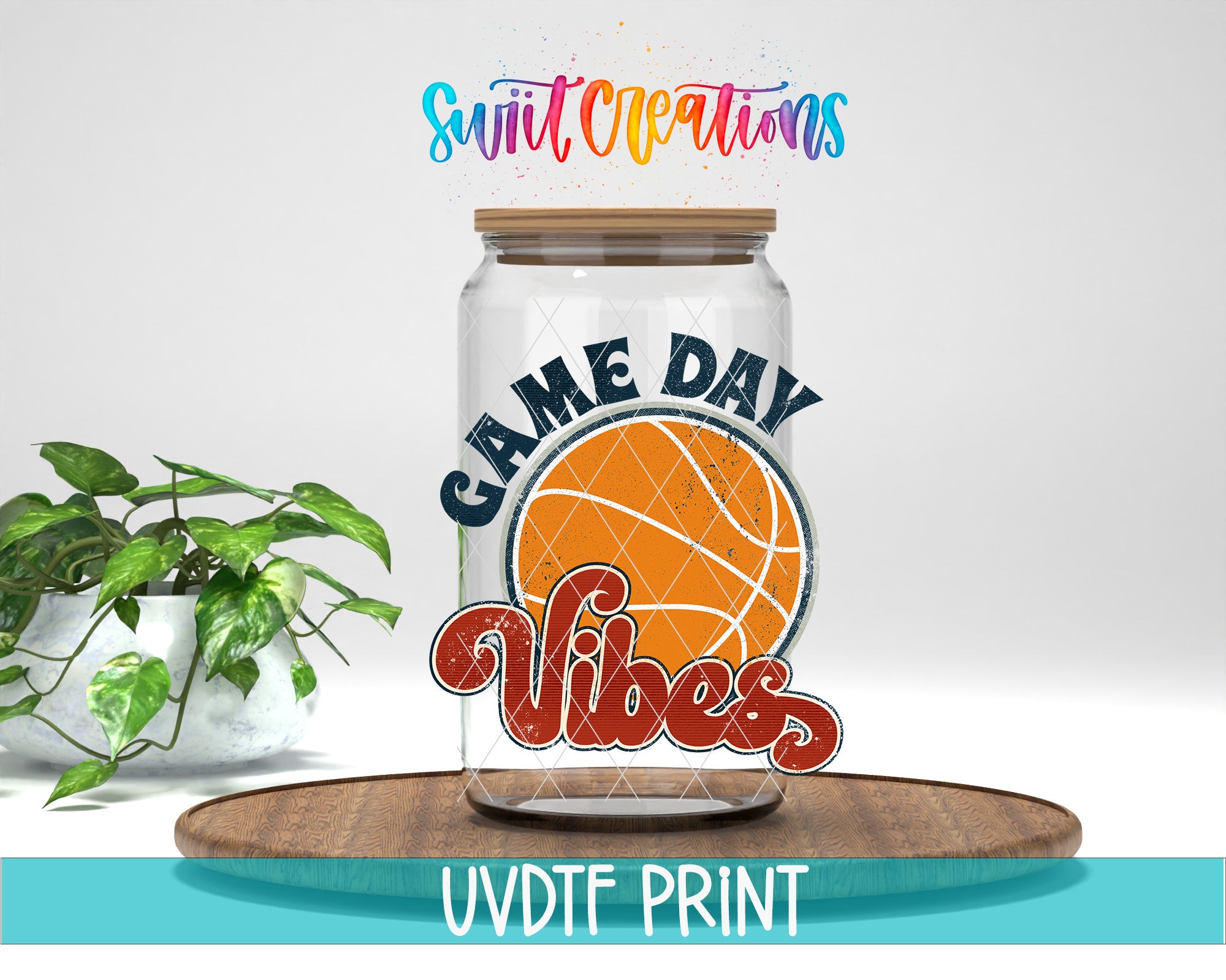 A glass jar with a basketball design and the text "GAME DAY VIBES" printed on it, placed on a wooden surface.