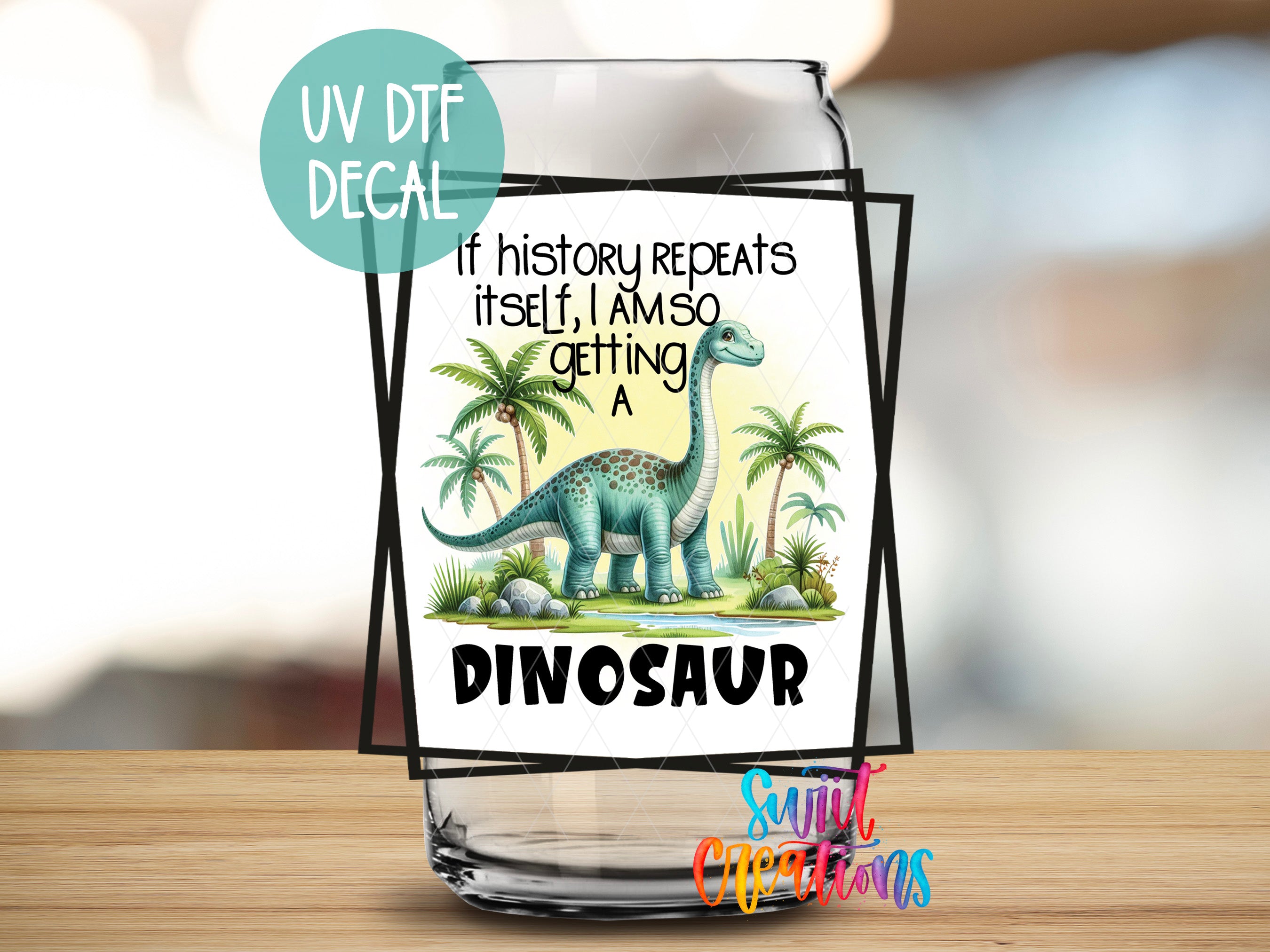 a glass with a picture of a dinosaur on it