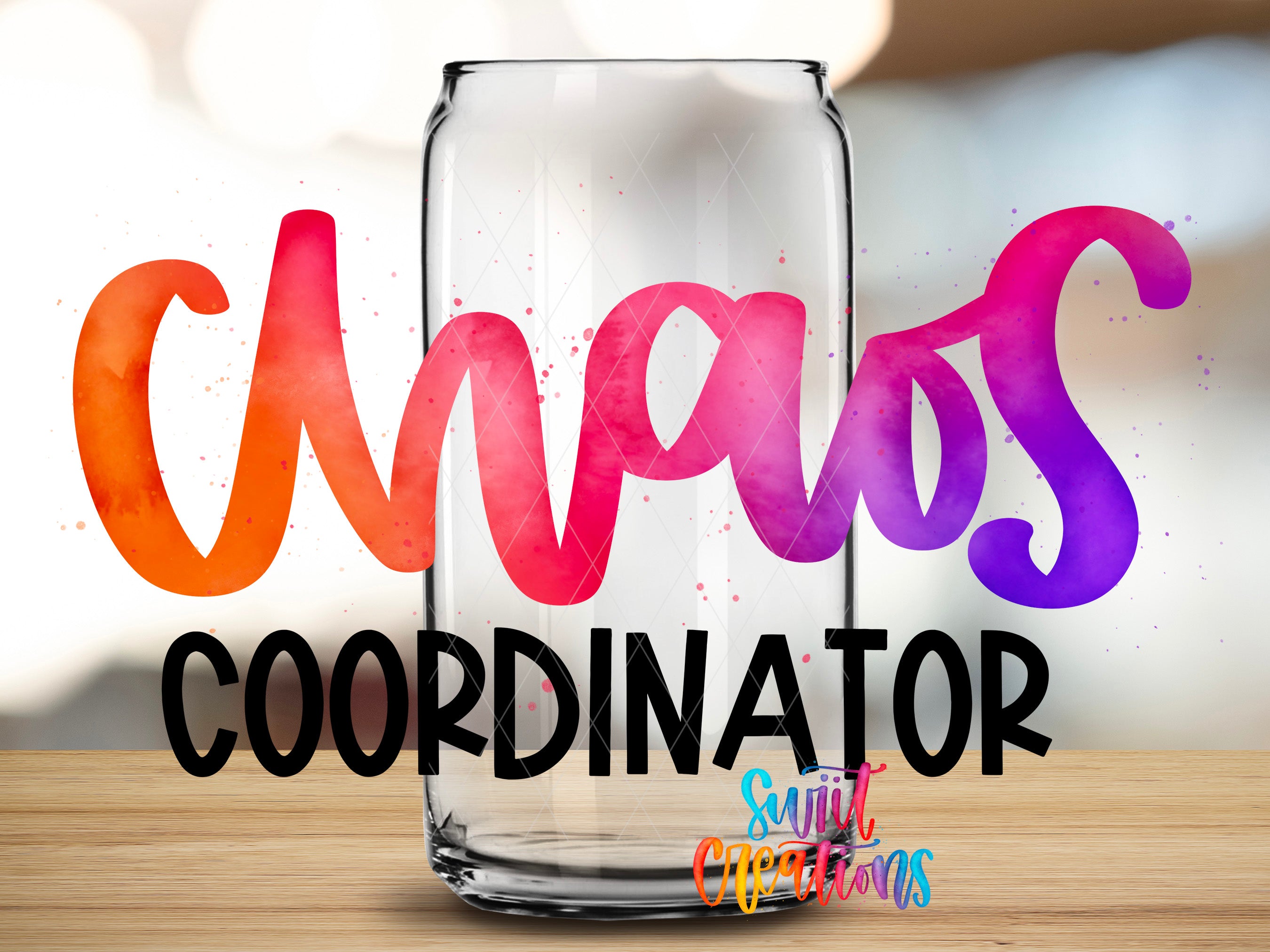 a glass can with colorful text on it, placed on a wooden surface.