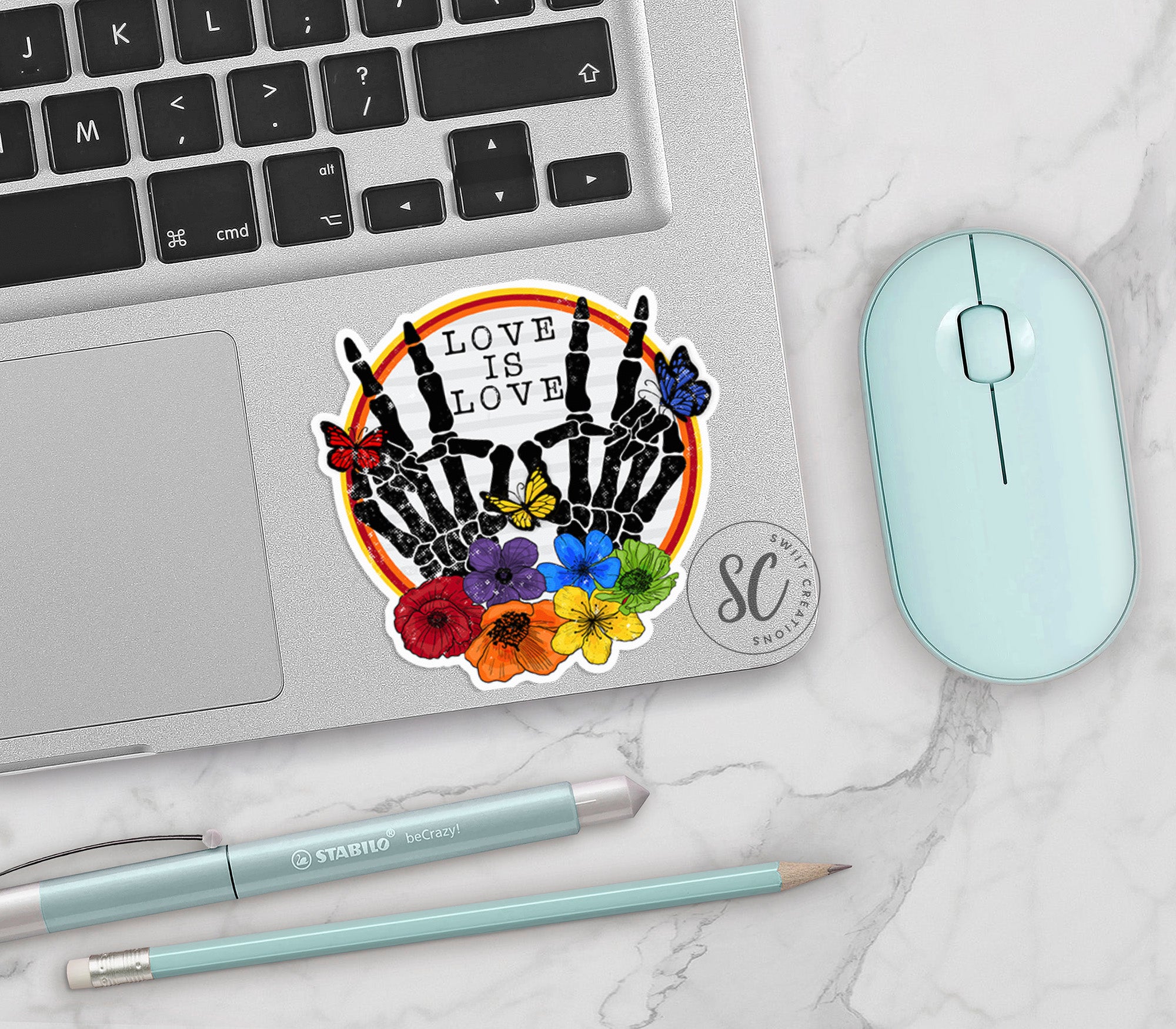 a laptop computer sitting on top of a white table