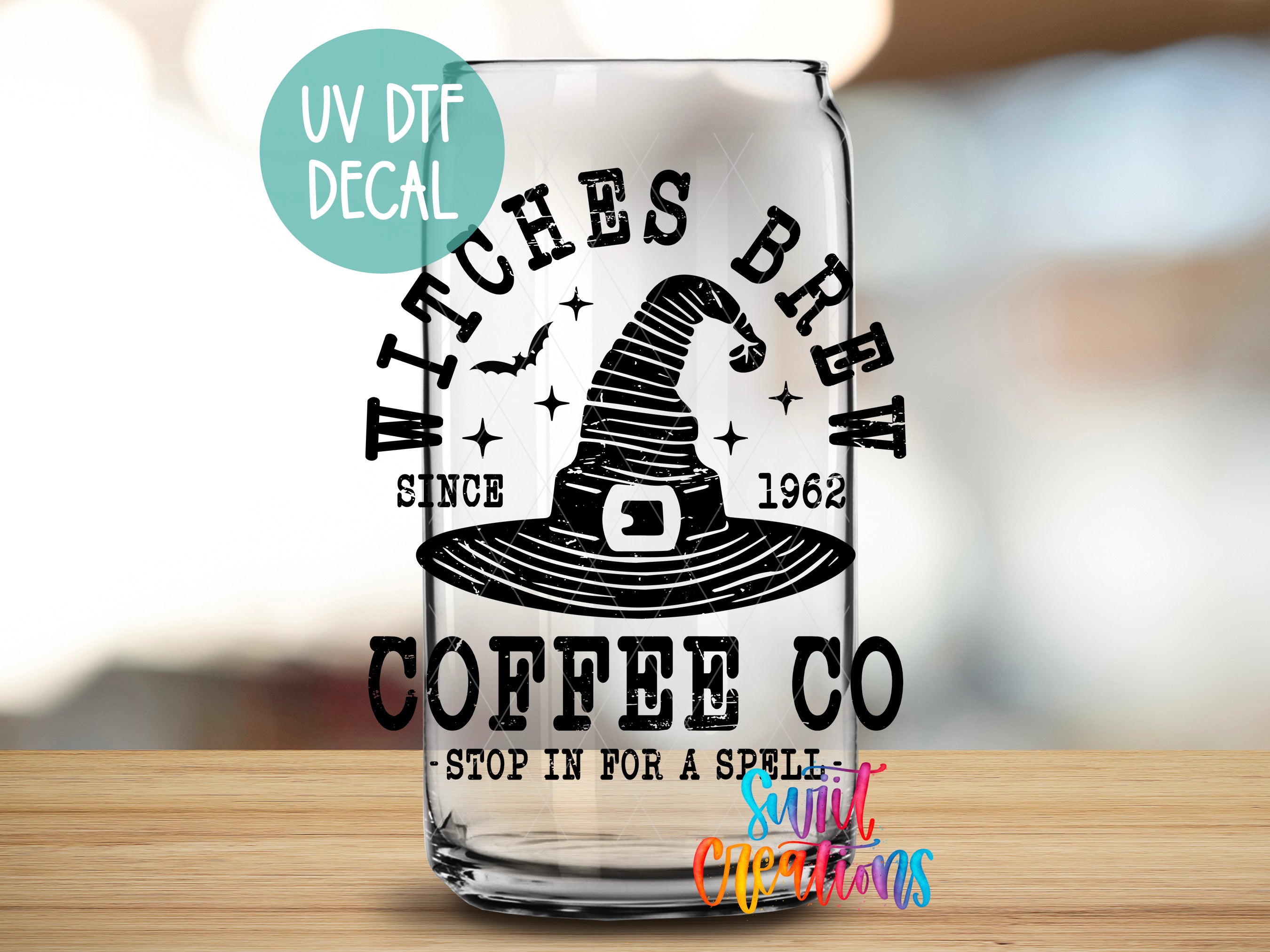 A glass can with a UV decal featuring a witch's hat and the text "WITCHES BREW CO" printed on it.