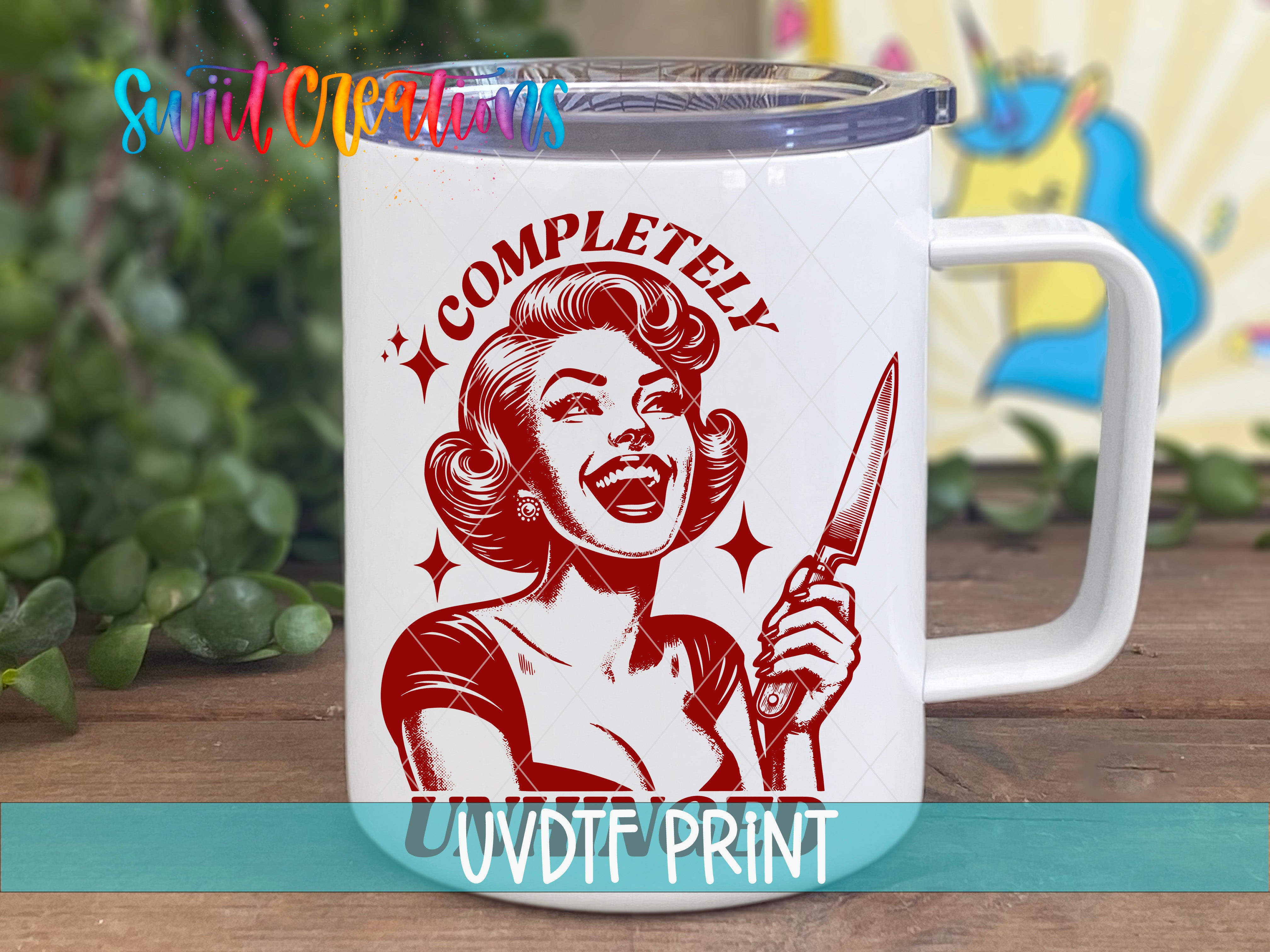 A white mug with a red and black illustration of a smiling woman holding a knife, along with the text "COMPLETELY UVDIF PRINT".
