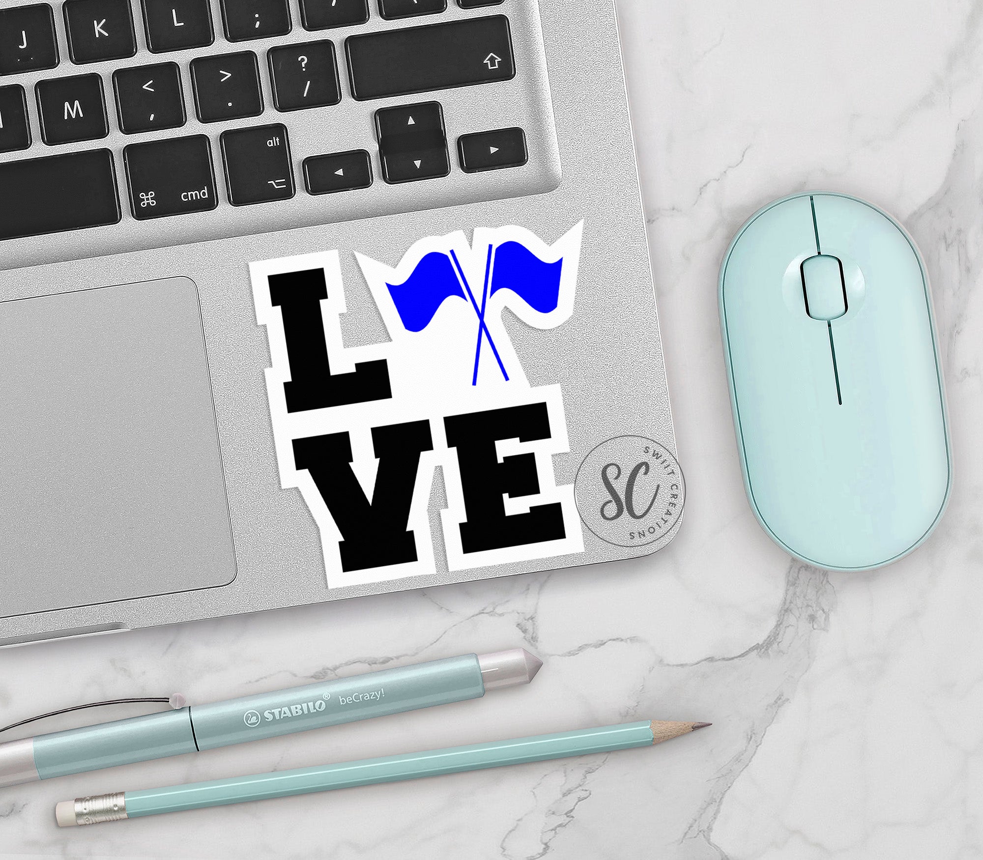 a laptop computer sitting next to a mouse and keyboard