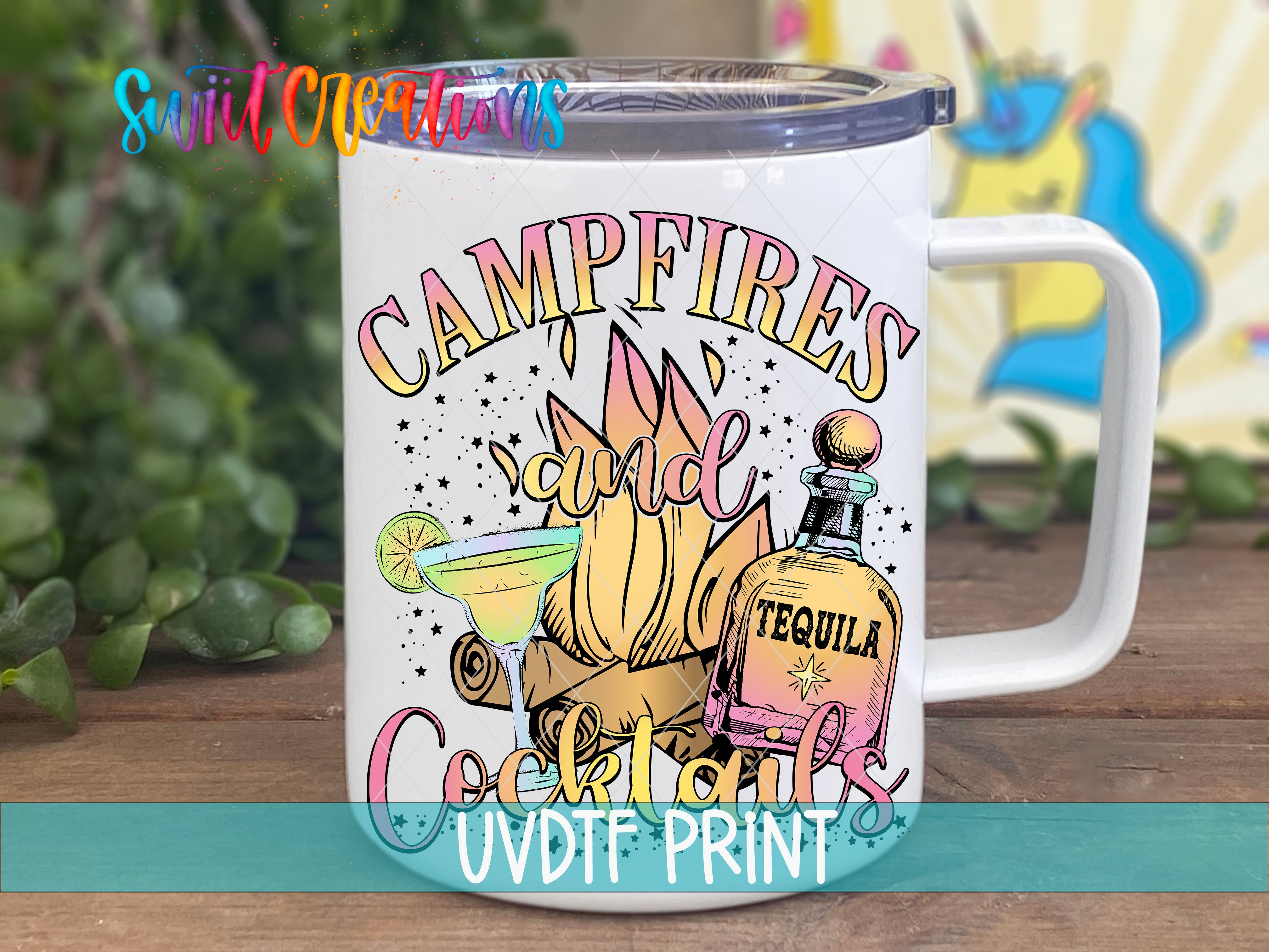 A white mug with a colorful design featuring a tequila bottle, cocktail glasses, and a campfire, along with the text "Campfires and Cocktails" and "UVDF PRINT".