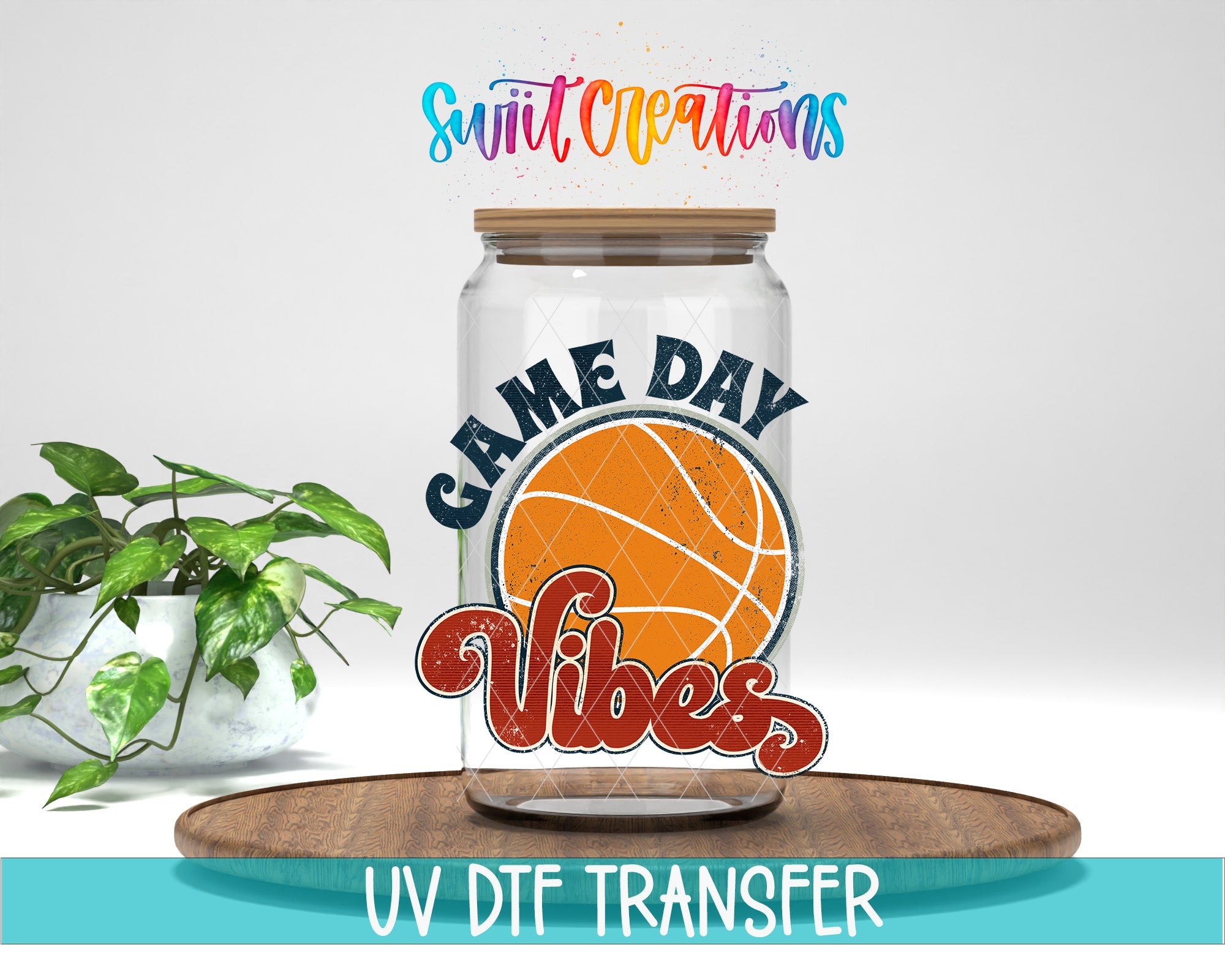 a glass jar with a basketball design and the text "GAME DAY VIBES" printed on it, placed on a wooden surface.