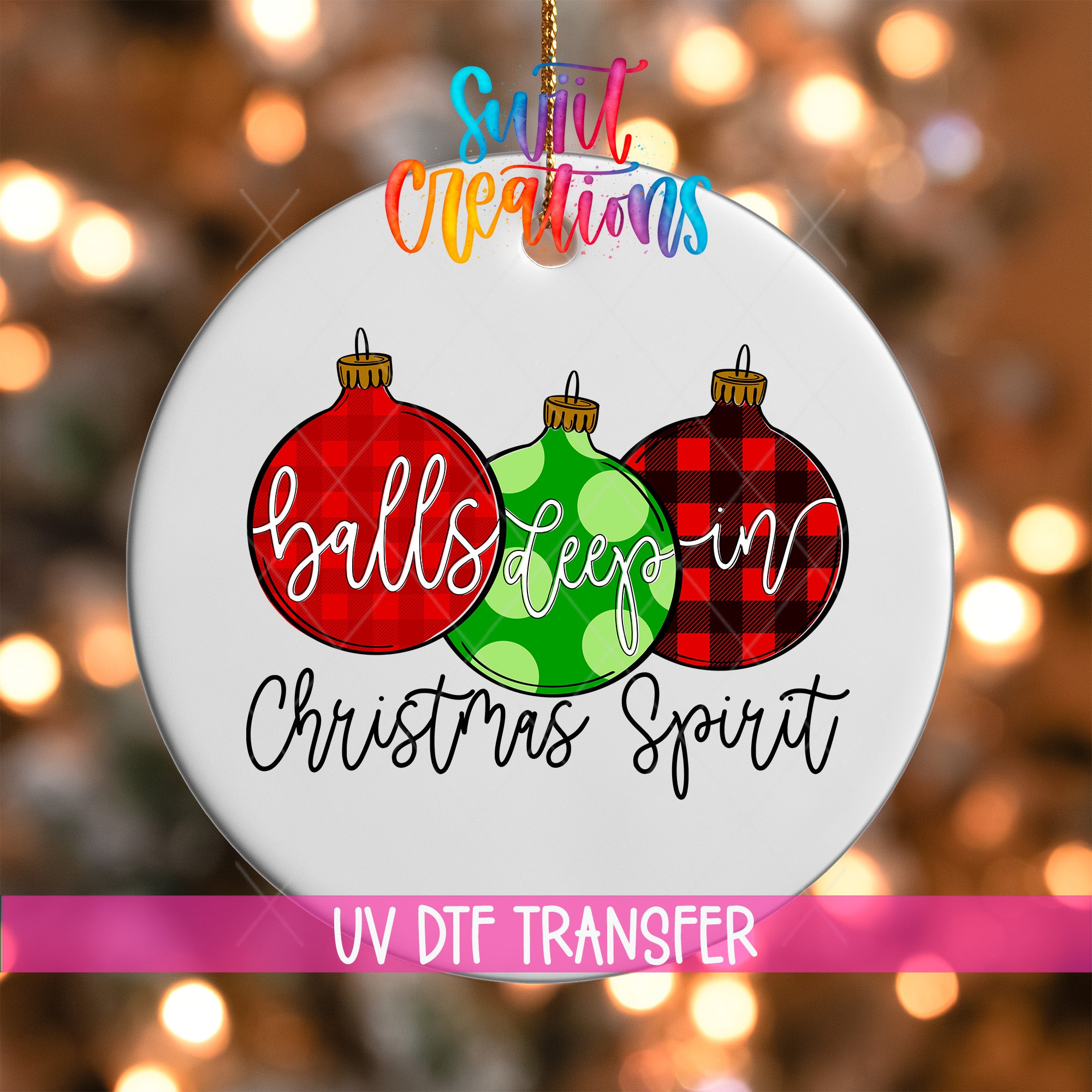 A white ornament with three Christmas ornaments in different colors - red, green, and red and black plaid - along with the text "balls deep in Christmas spirit" and "UV DFT TRANSFER".