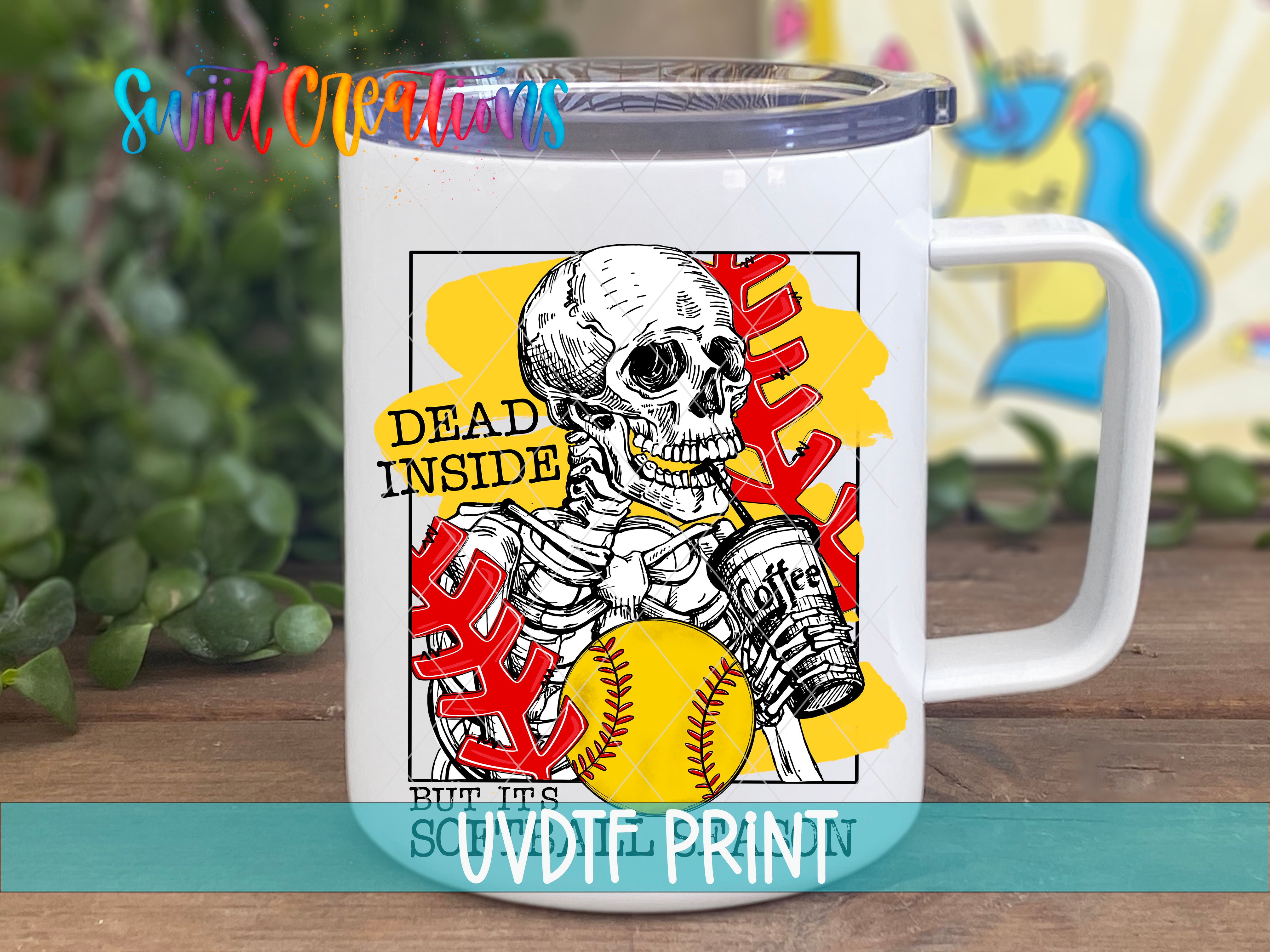 A white mug with a colorful illustration of a skeleton holding a baseball and a sign that says "Dead inside".