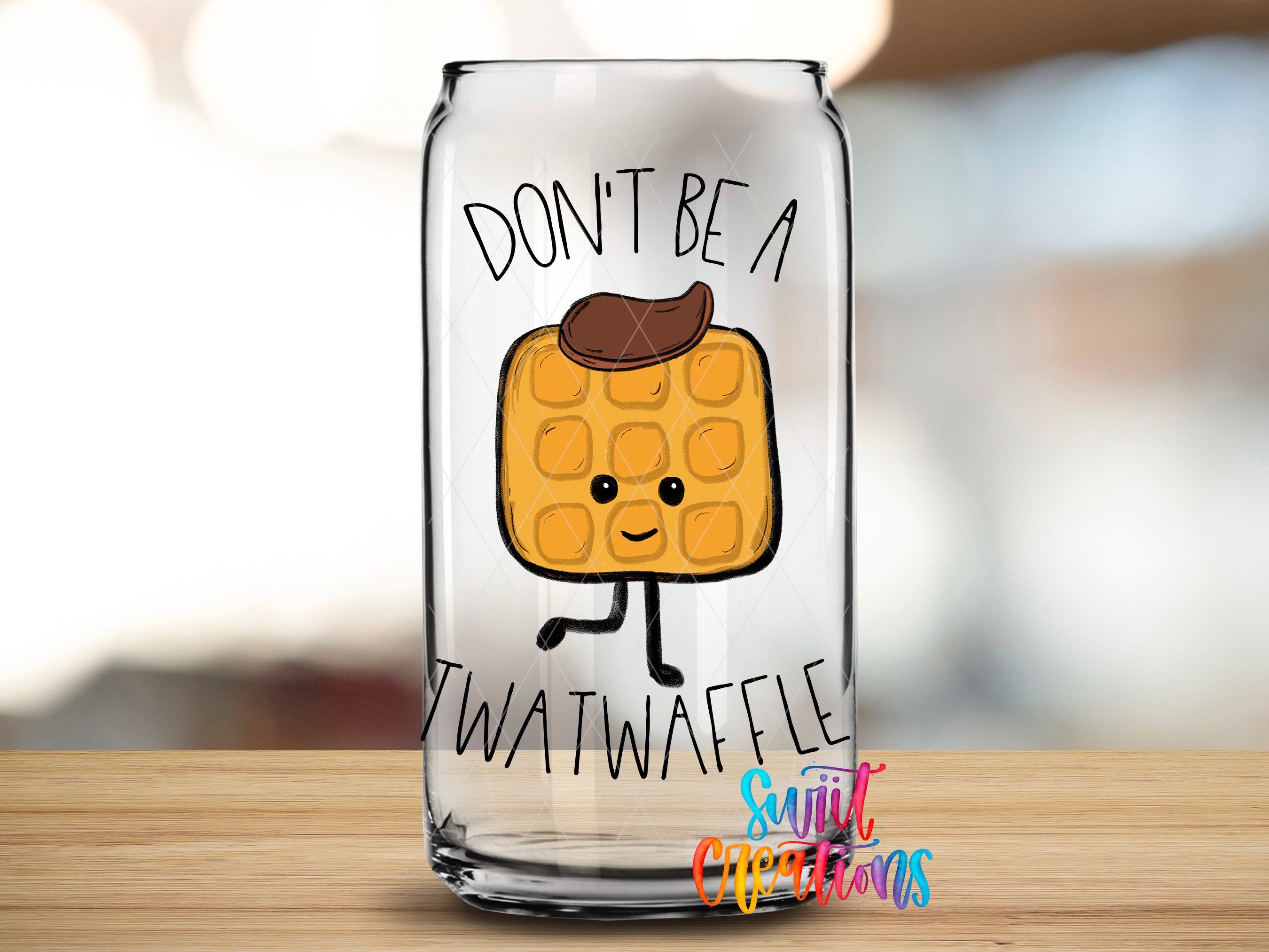 A glass can with a cartoon waffle on it, along with the text "DON'T BE A TWATWAVEL".