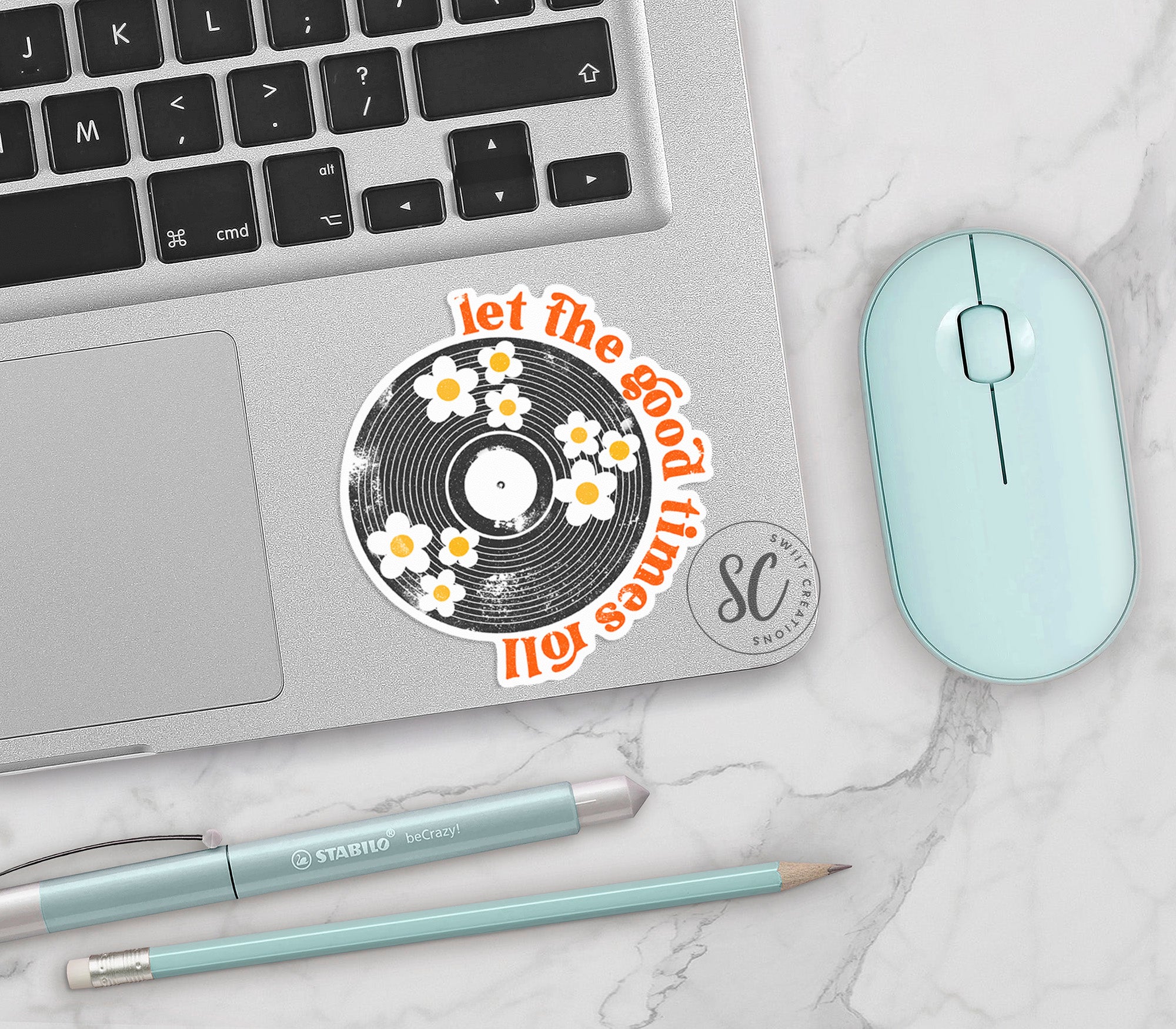 a laptop computer sitting next to a mouse and keyboard