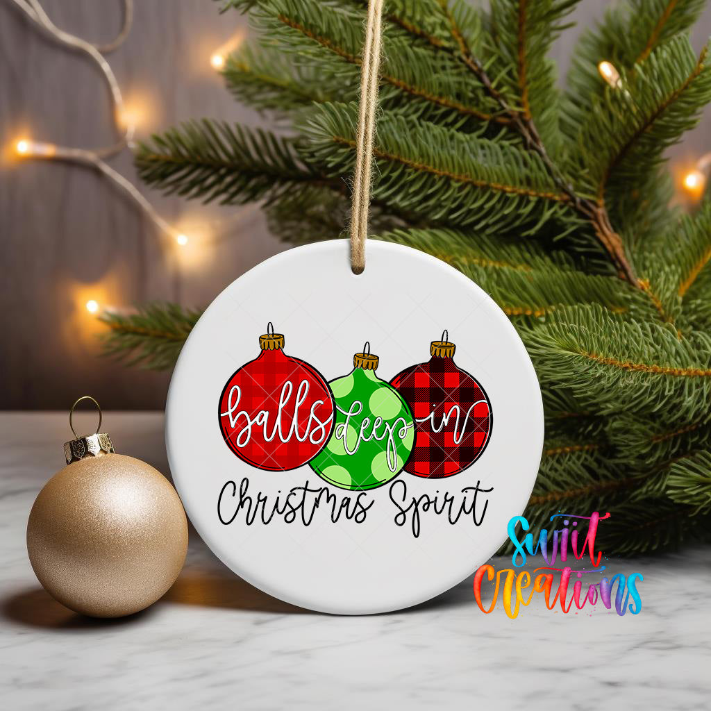A white ceramic ornament with a Christmas tree in the background, featuring three Christmas ornaments and the text "balls keep in christmas spirit" written on it.
