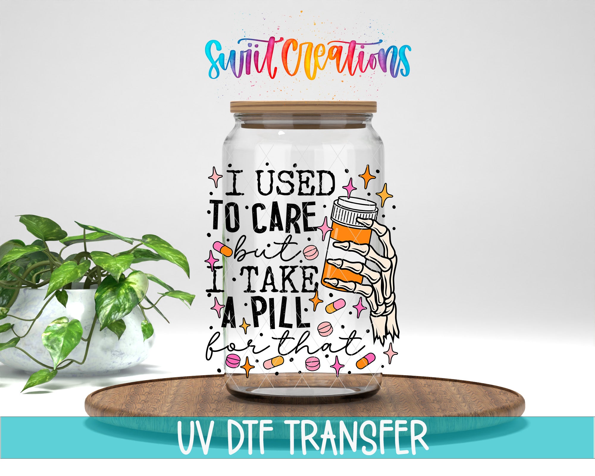 a glass jar with a colorful design and text, placed on a wooden surface.