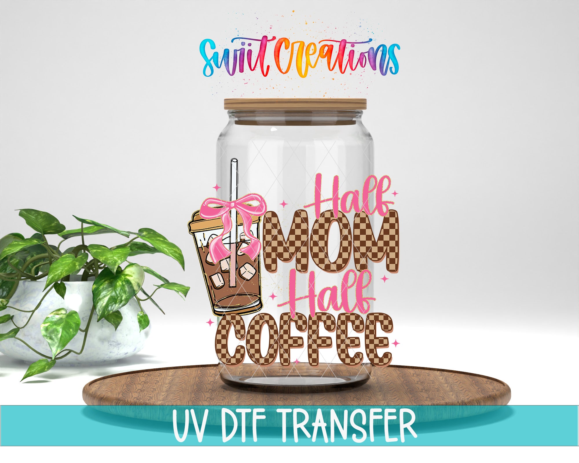a glass jar with a label that says "Half Mom Half Coffee" and a pink bow, placed on a wooden surface. There is also a plant in the background.