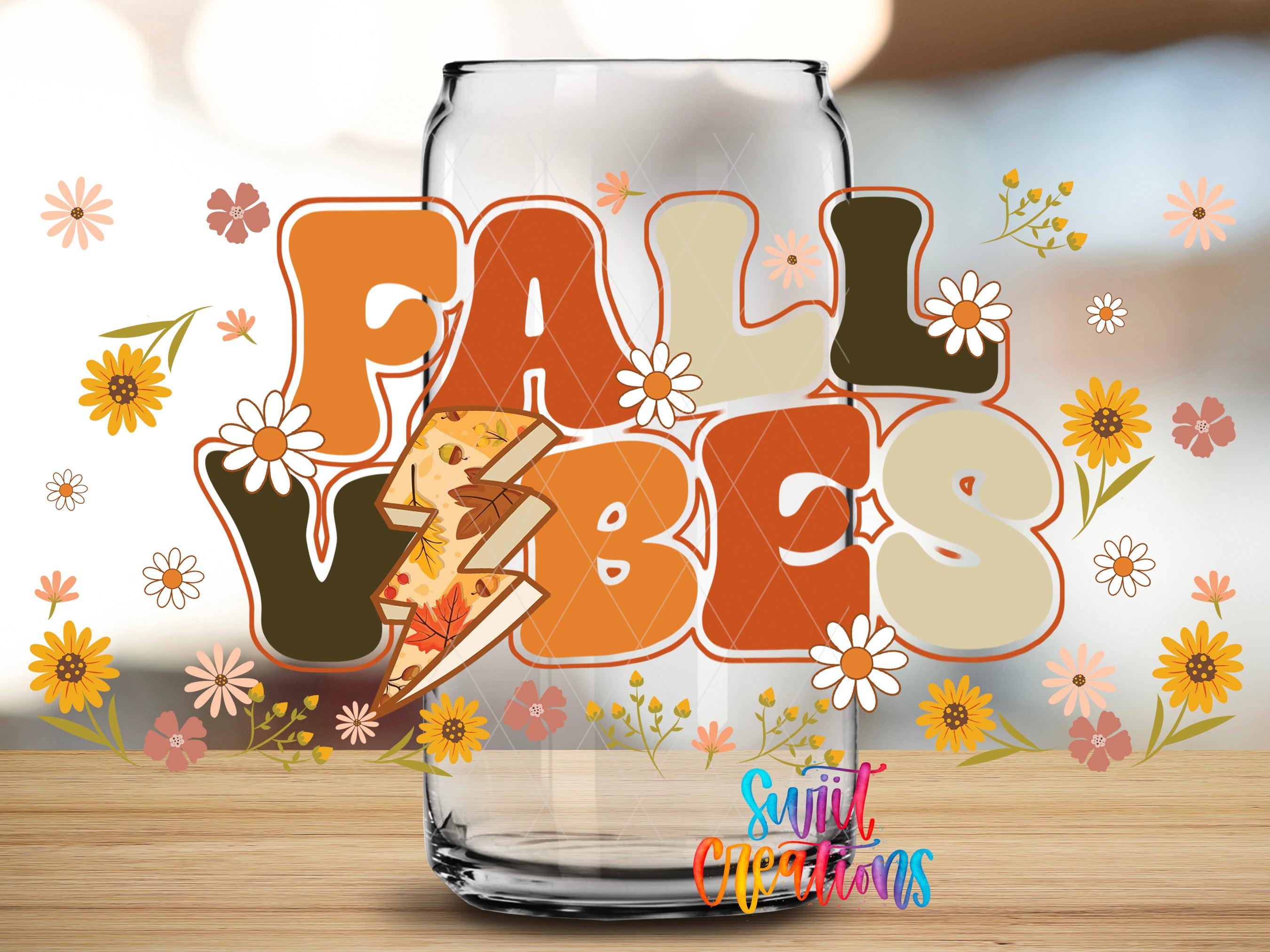 a glass jar with the word "FALL VIBES" written on it, surrounded by various fall-themed elements such as flowers and leaves.