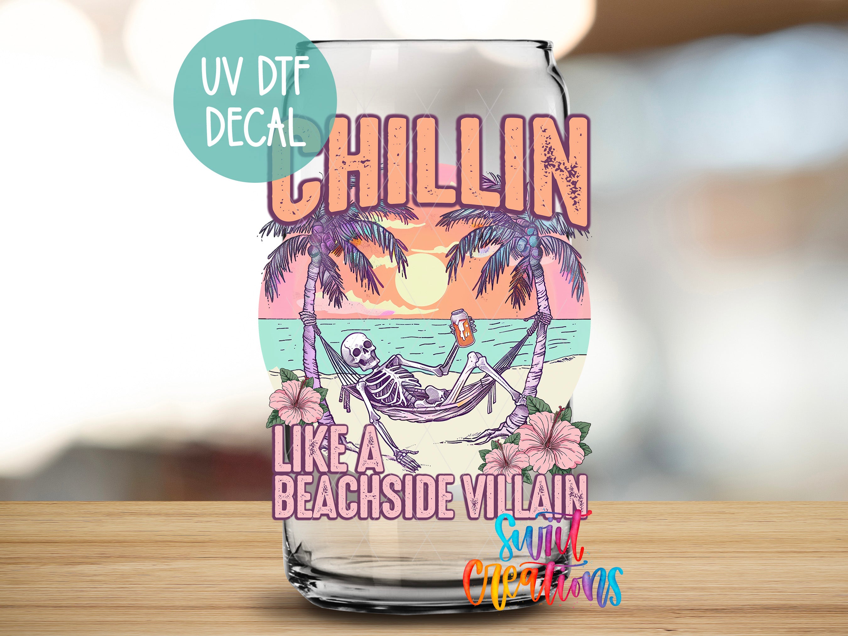 a glass with a picture of a man in a hammock on the beach