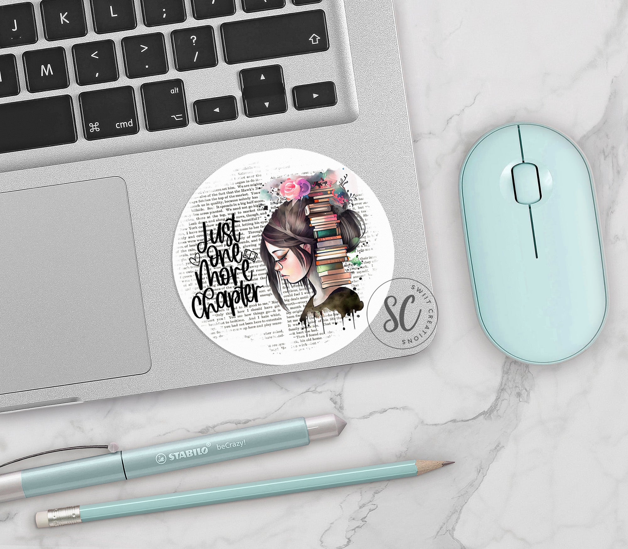 a laptop computer sitting next to a mouse and keyboard