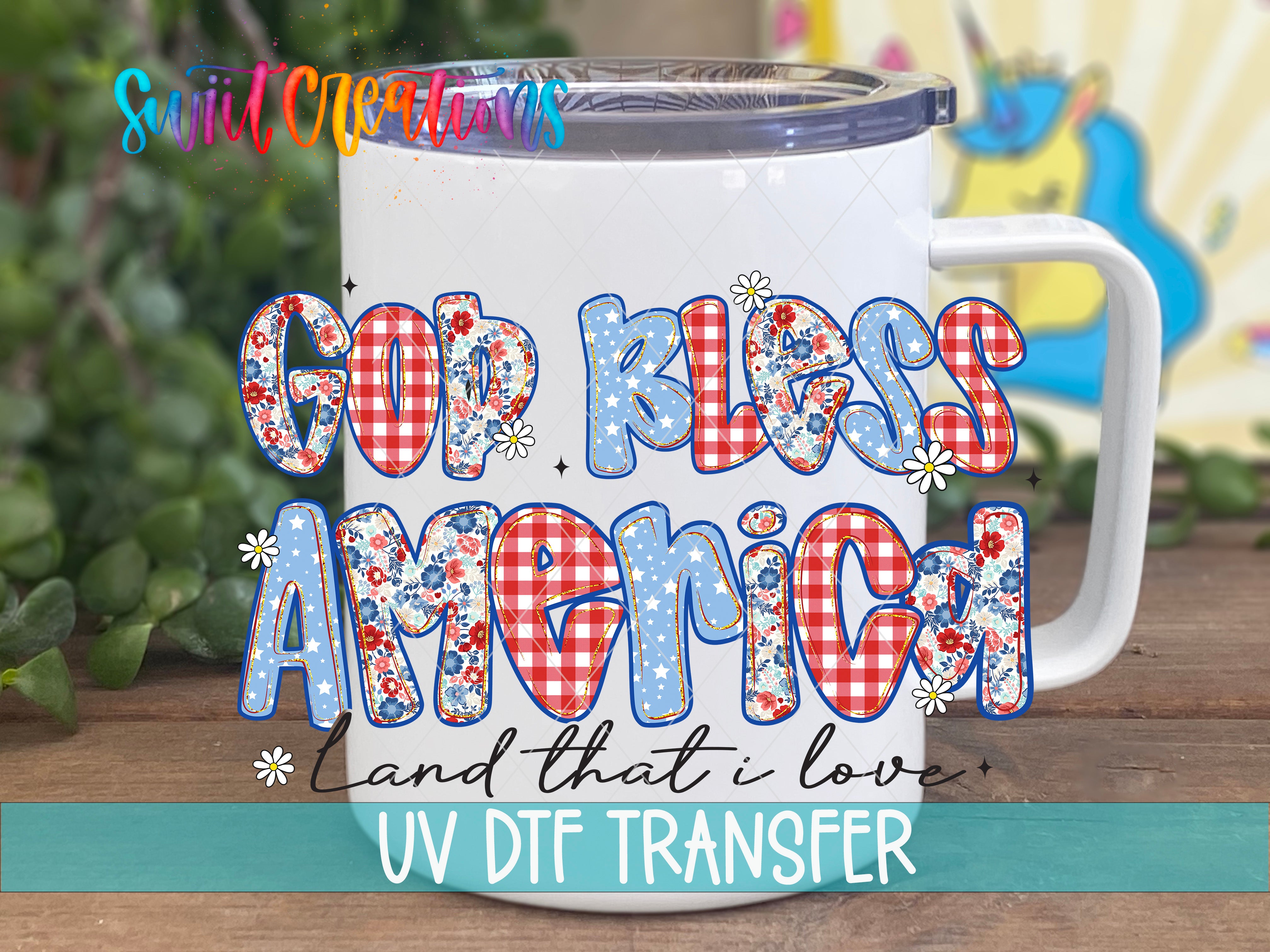 A white mug with colorful floral designs and text, placed on a wooden surface.