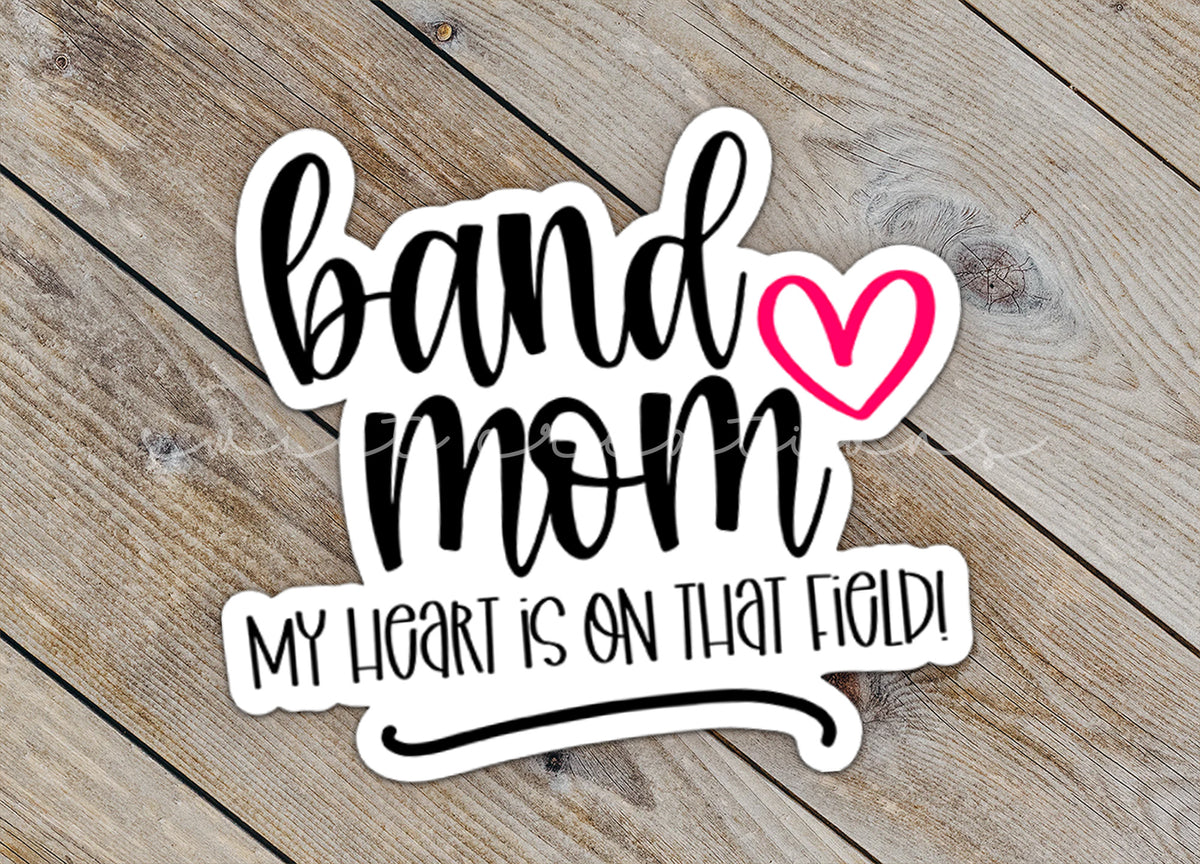 a sticker that says band mom my heart is on that field