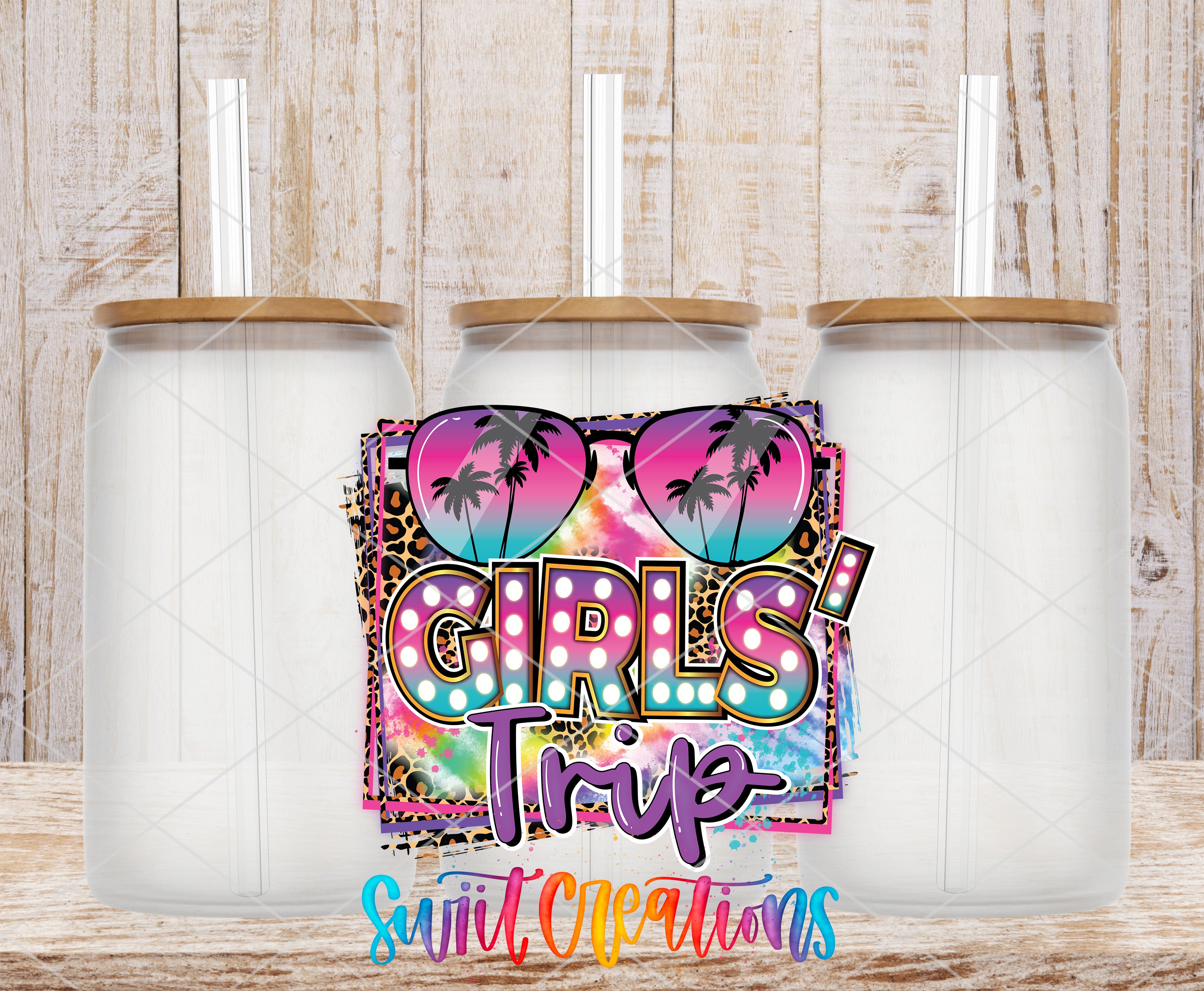 three clear glass jars with lids, arranged in a row against a wooden background. The jars have a colorful, tropical-themed design, including palm trees and a rainbow pattern. The text "GIRLS' TRIP" is prominently displayed in the center of the image, and the phrase "Sweet Creations" is written at the bottom.