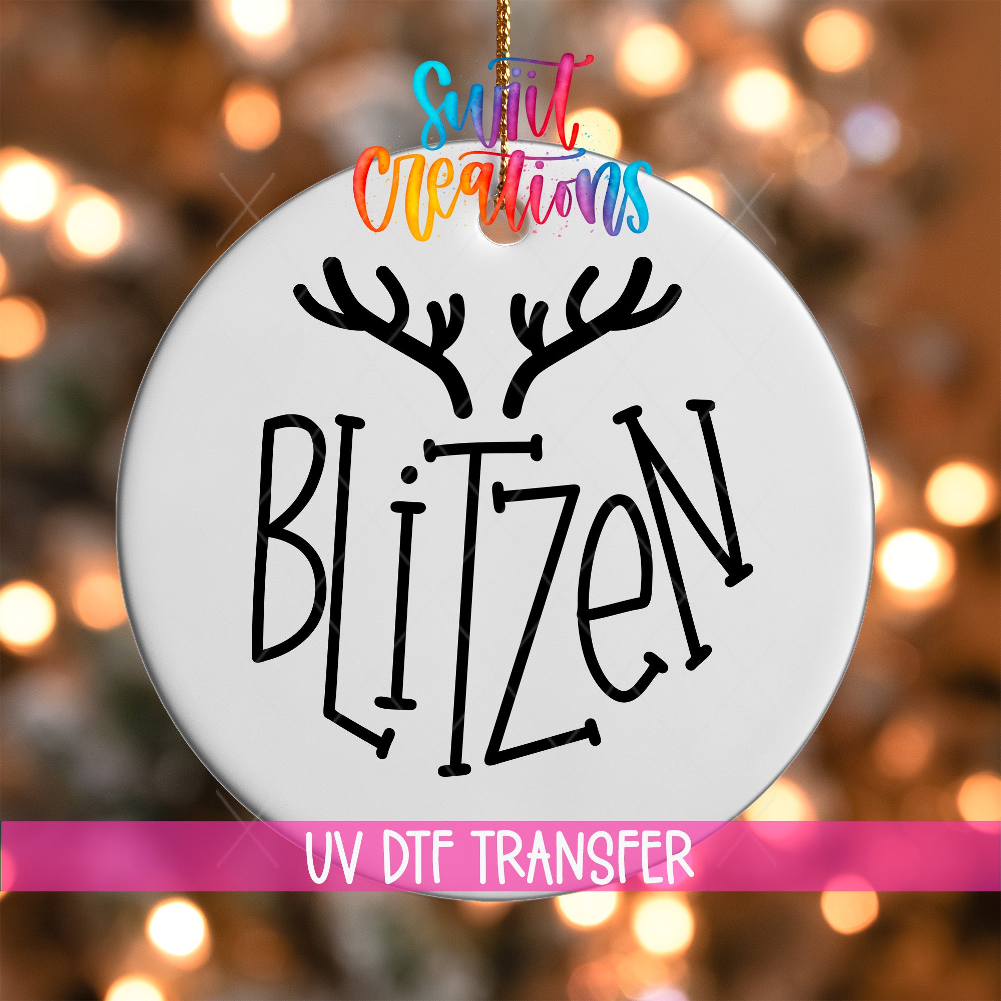 A white ornament with the word "BLITZEN" written on it, hanging against a background of colorful lights.