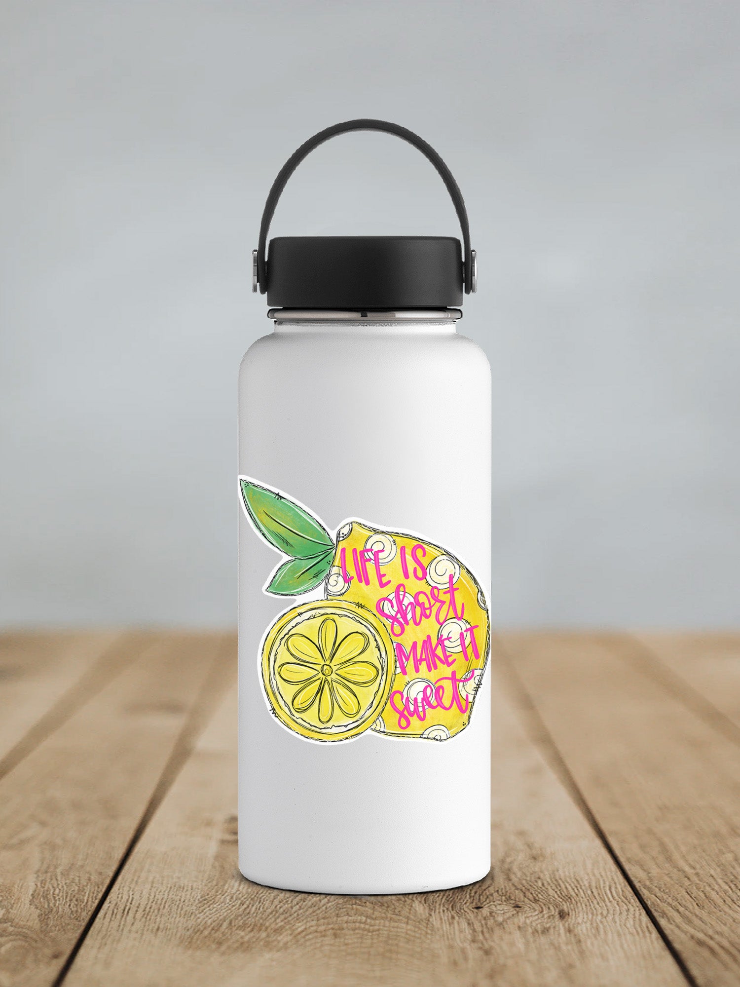 a water bottle with a sticker of a lemon on it
