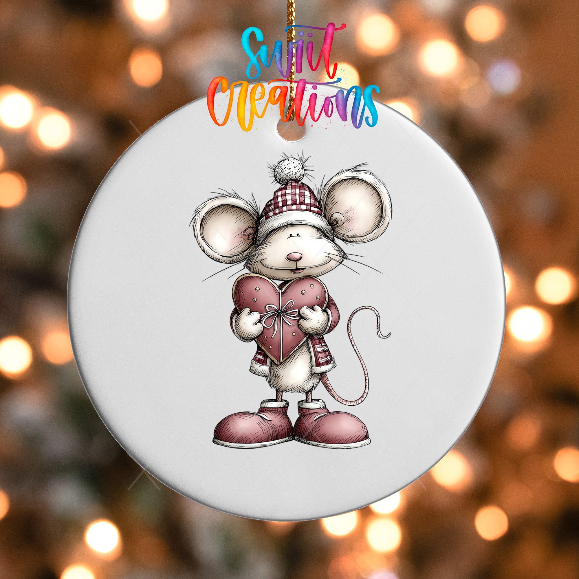 A white ornament featuring a cartoon mouse holding a heart and wearing a plaid hat.