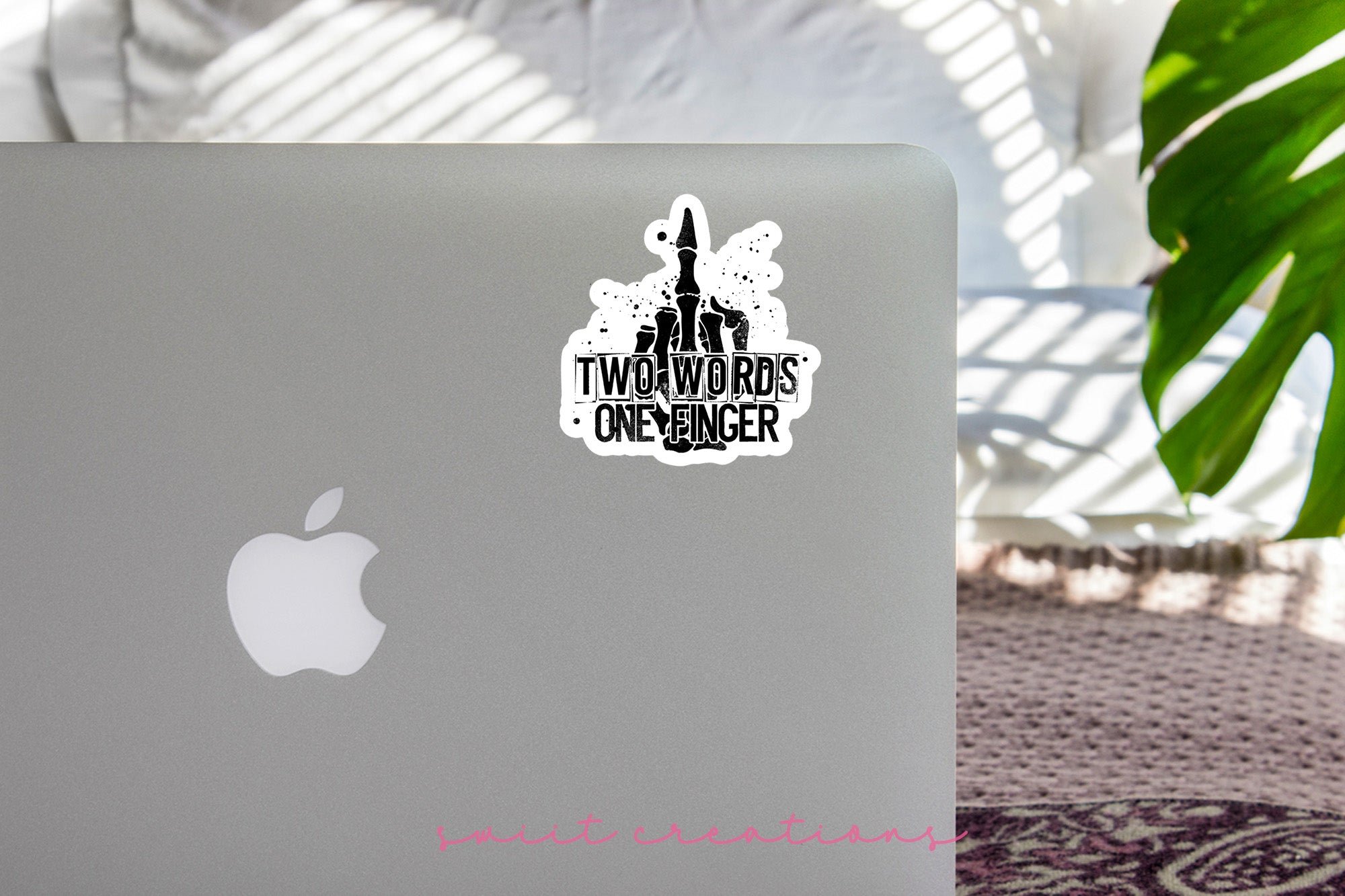 a laptop computer sitting on top of a table