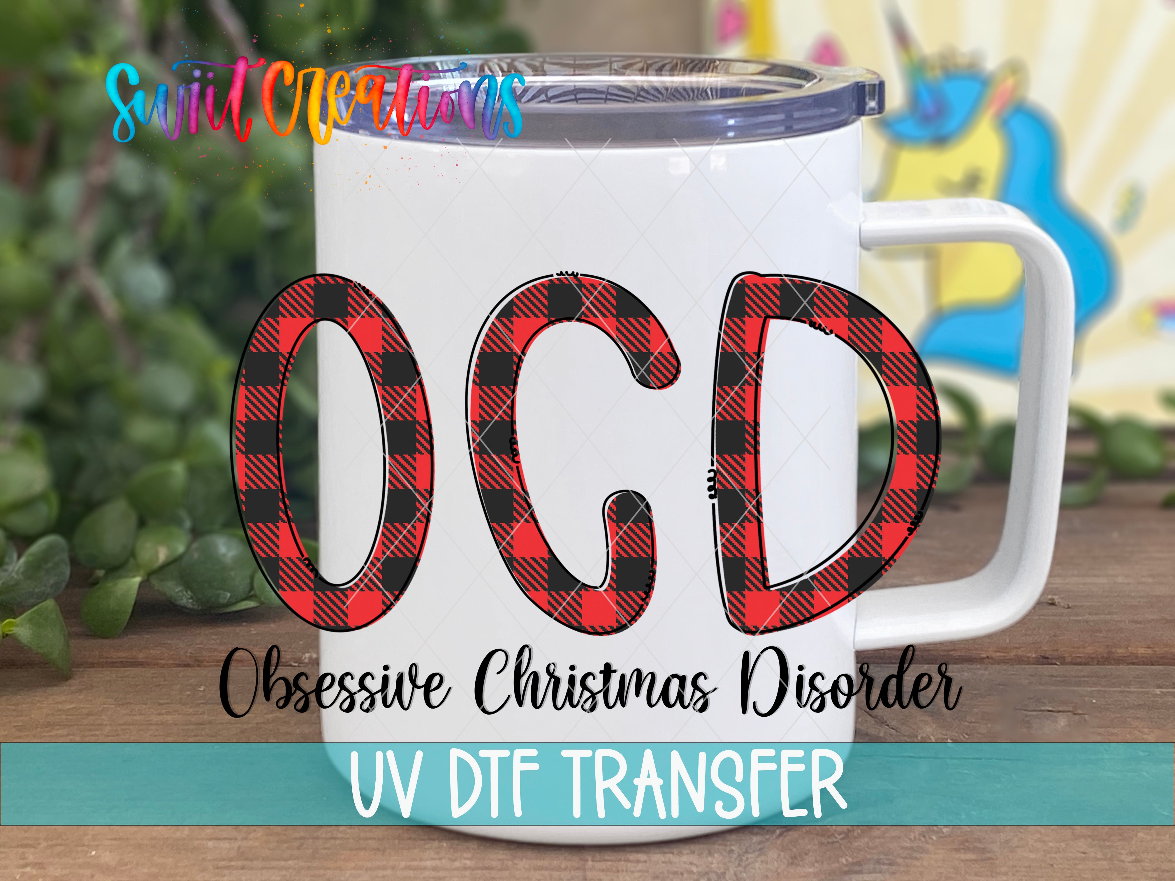 A white mug with a lid and handle, featuring a graphic design with the text "OCD" in a stylized font.