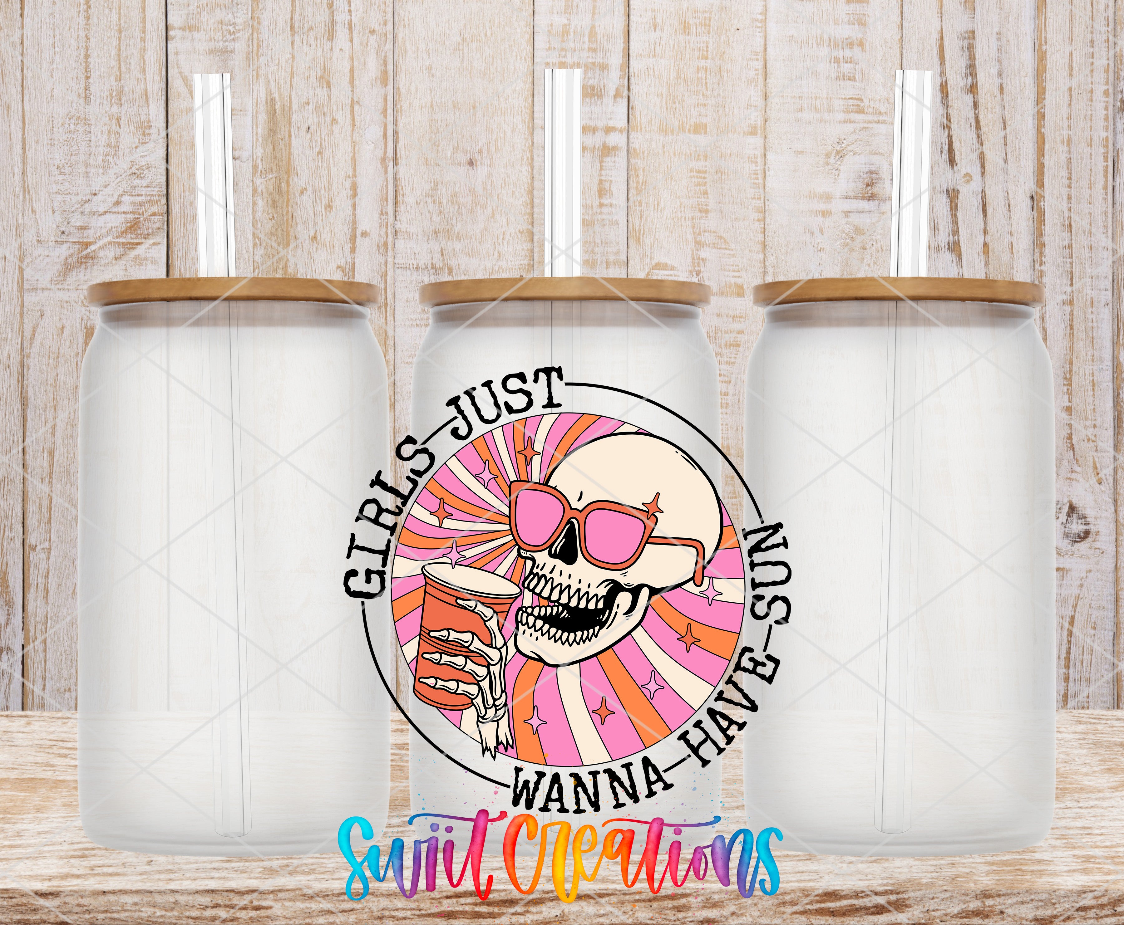three clear glass jars with lids, each containing a straw. The jars are arranged in a row, and there is a colorful graphic design on the center jar that includes a skull wearing sunglasses and holding a drink. The design also includes the text "GIRLS JUST WANNA HAVE SUN" around the central image.