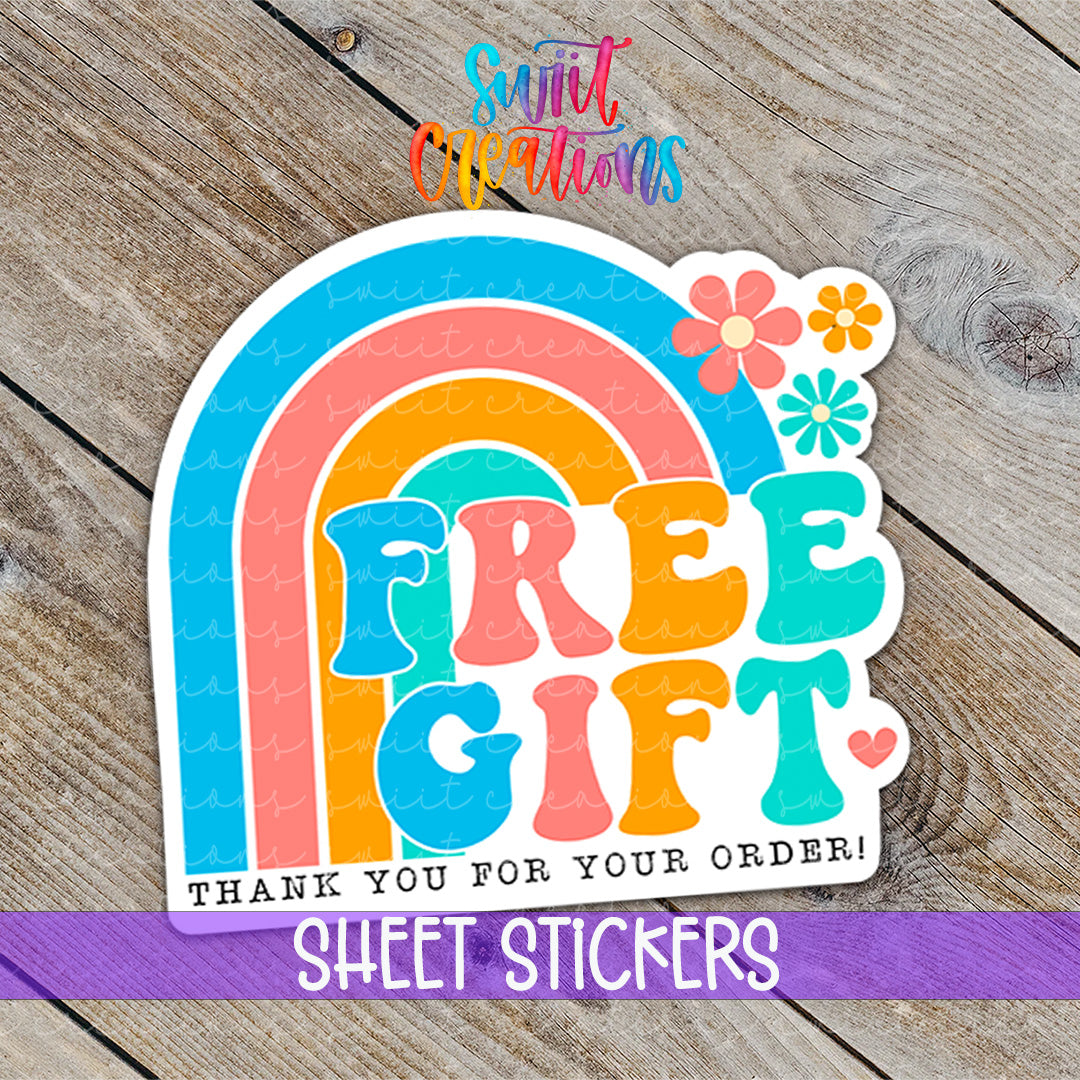 a sticker with the words free gift on it