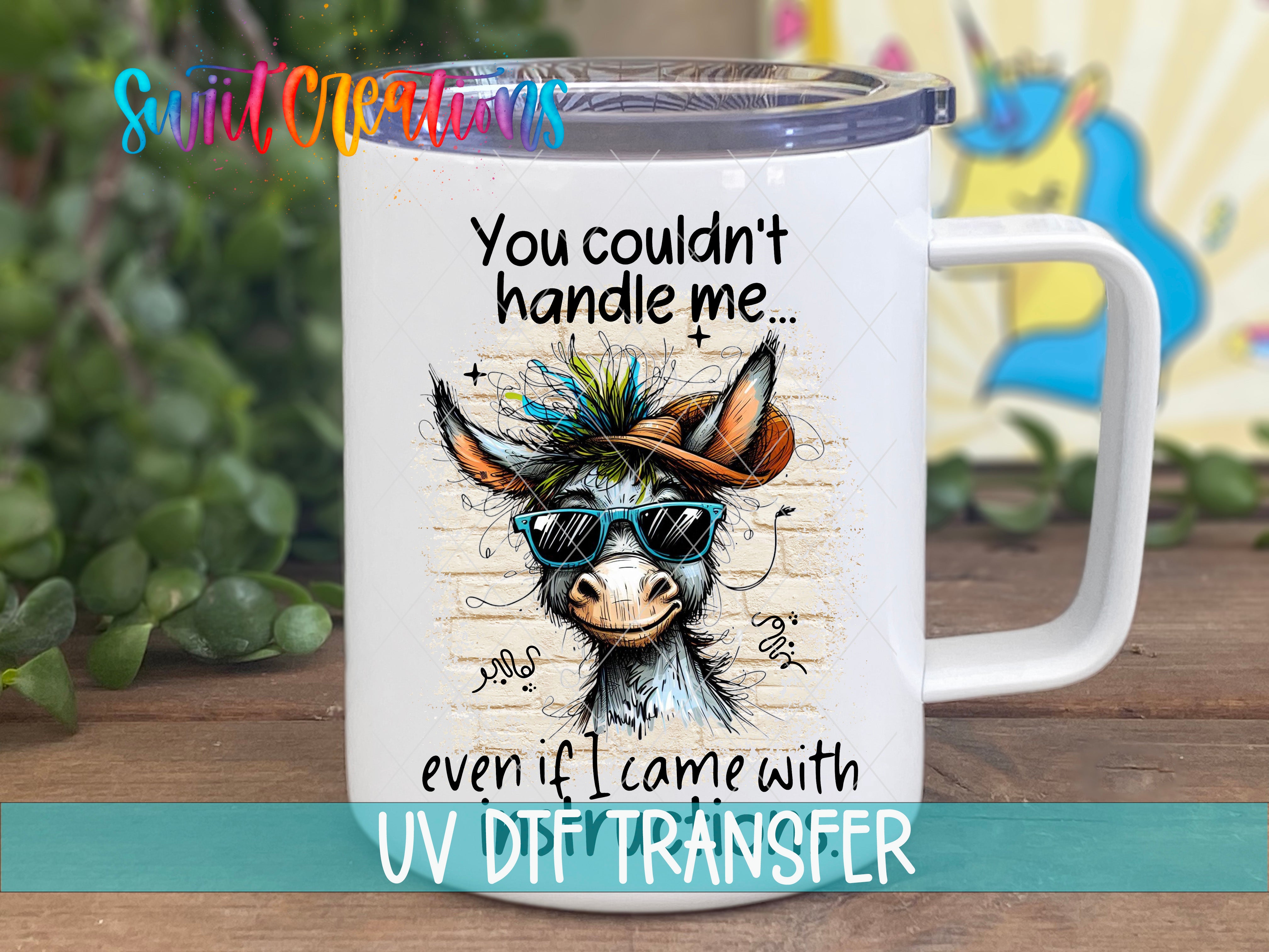A white mug with a cartoon donkey wearing sunglasses and a hat, along with text that says "You couldn't handle me even if I came with UV DIF TRANSFER".