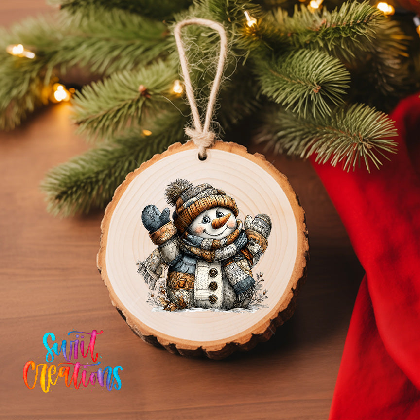 A wooden ornament featuring a snowman is hanging on a Christmas tree, surrounded by pine branches and twinkling lights.