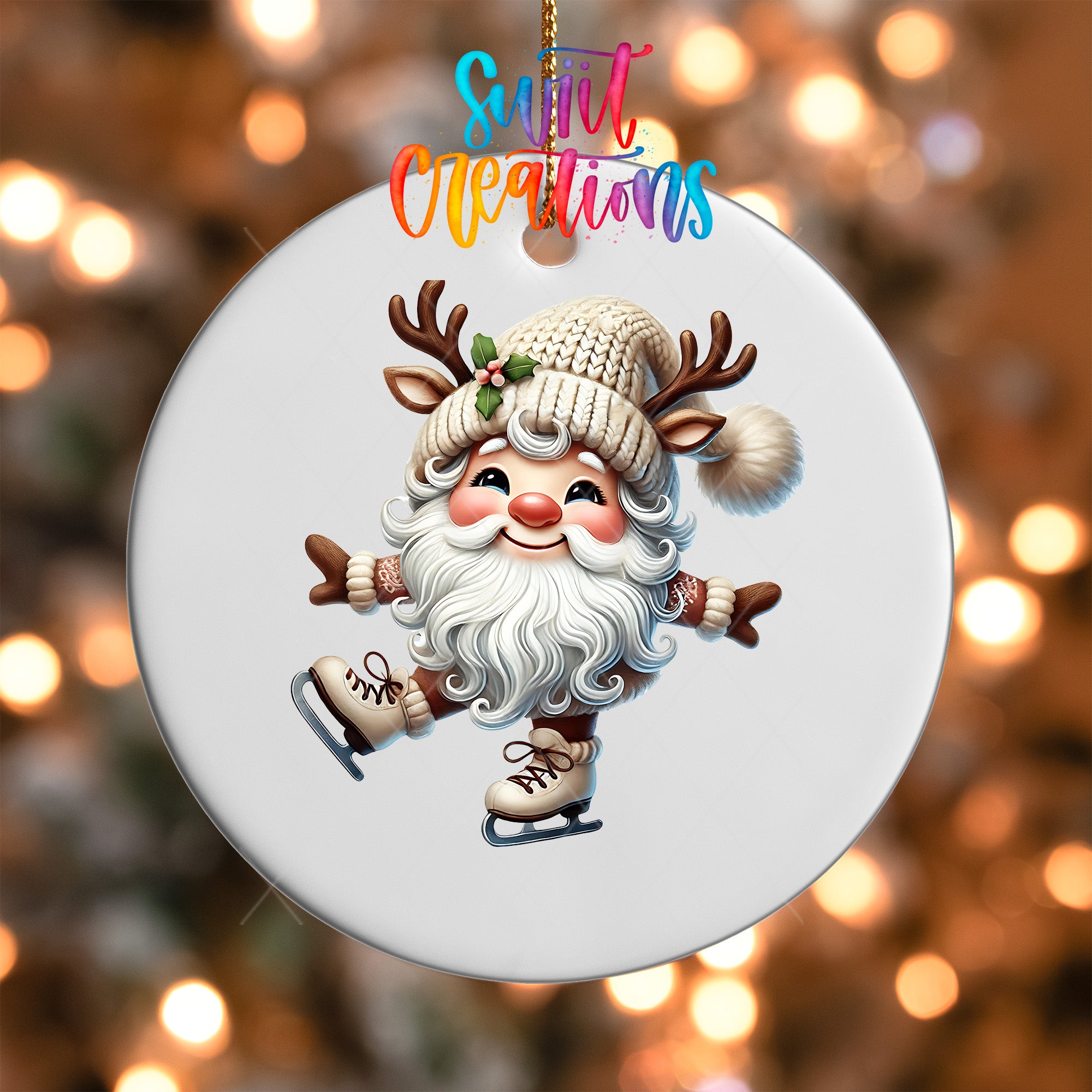 A white ornament with a smiling reindeer figure wearing a hat and skis, set against a blurred background with colorful lights.