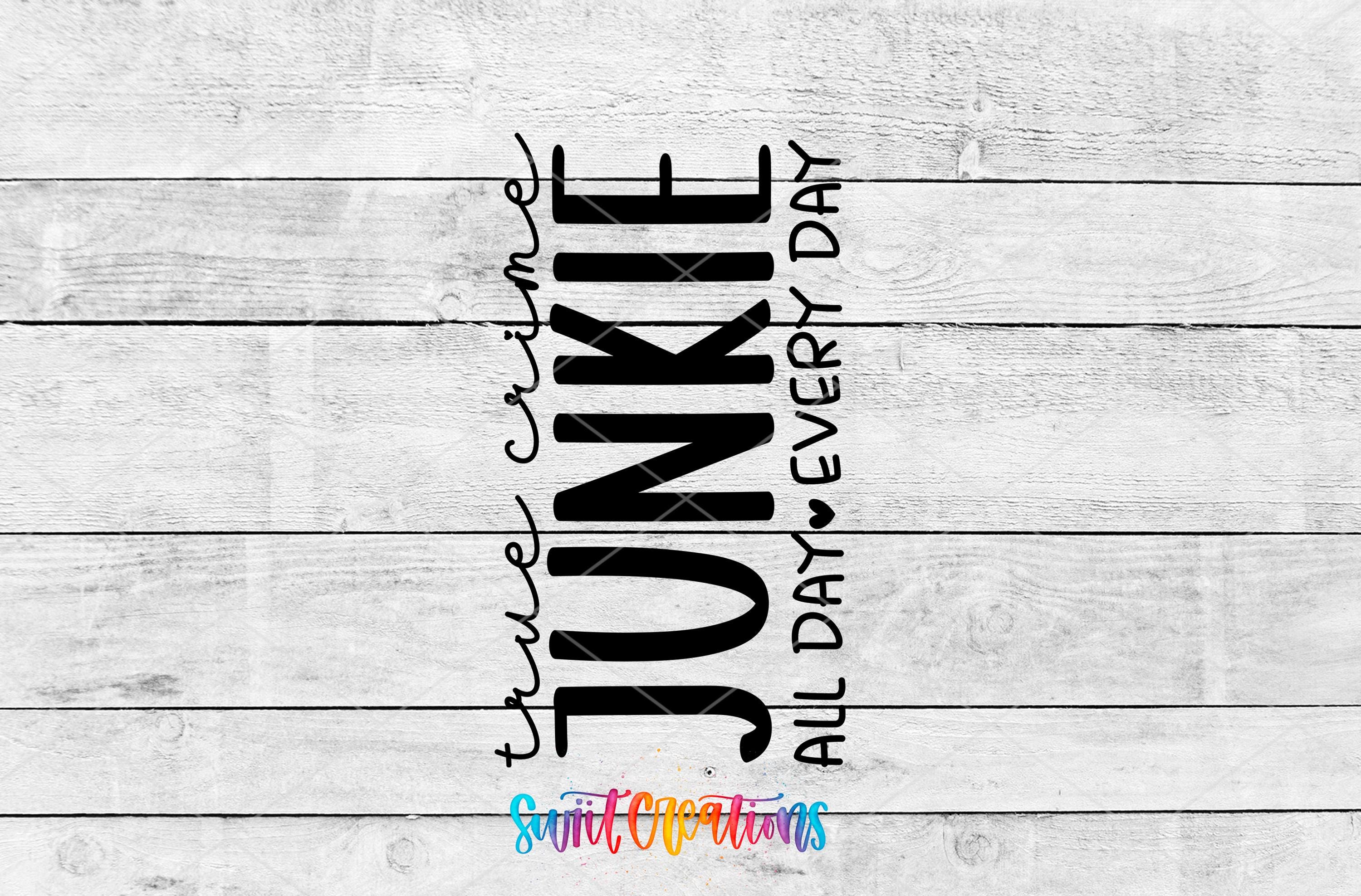 the text "JUNKY" in a vertical orientation, with "TRUE CRIME" and "ALL DAY EVERY DAY" written below it. The background is a white wooden surface with horizontal planks.