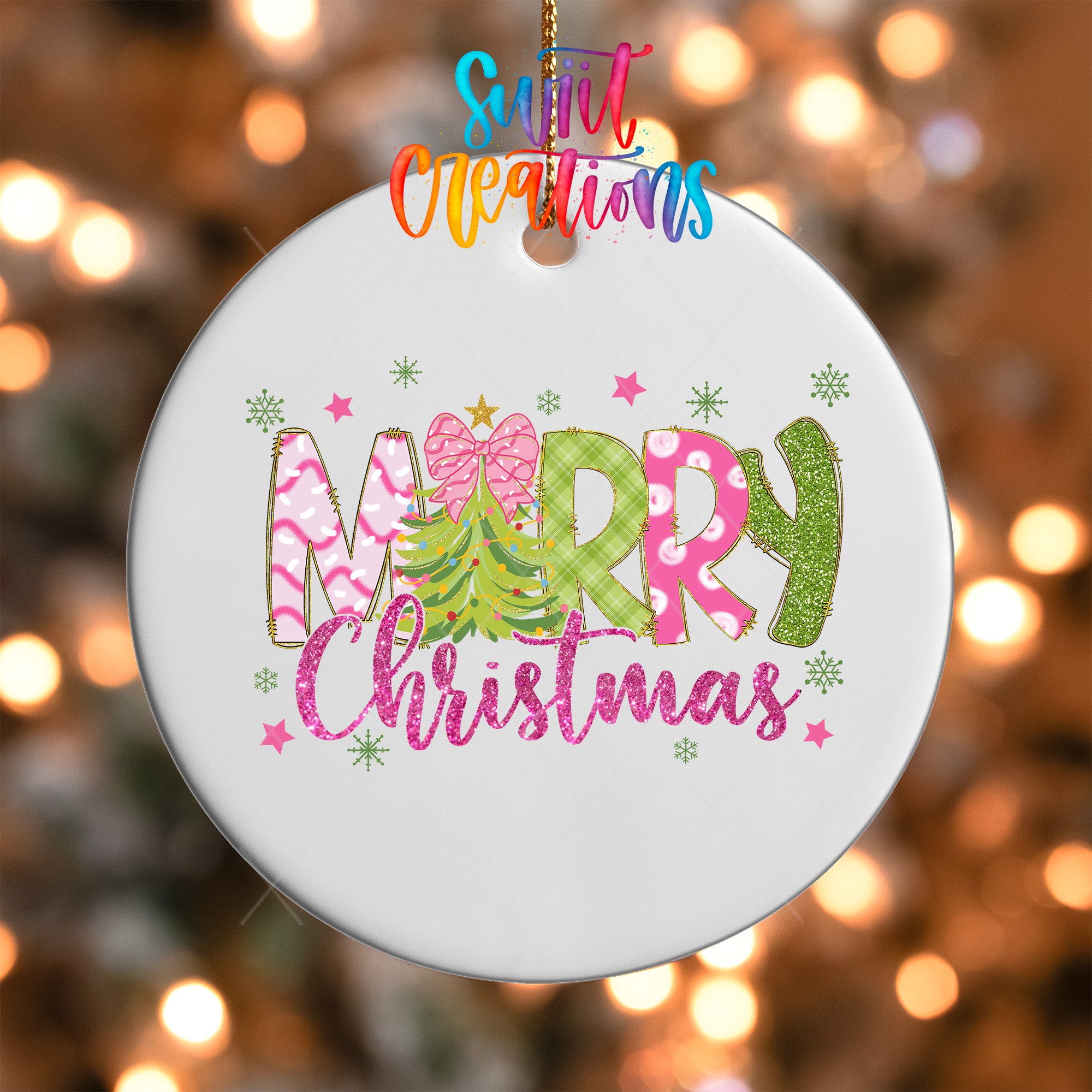 A white Christmas ornament with the text "Merry Christmas" in colorful letters, surrounded by snowflakes and stars.