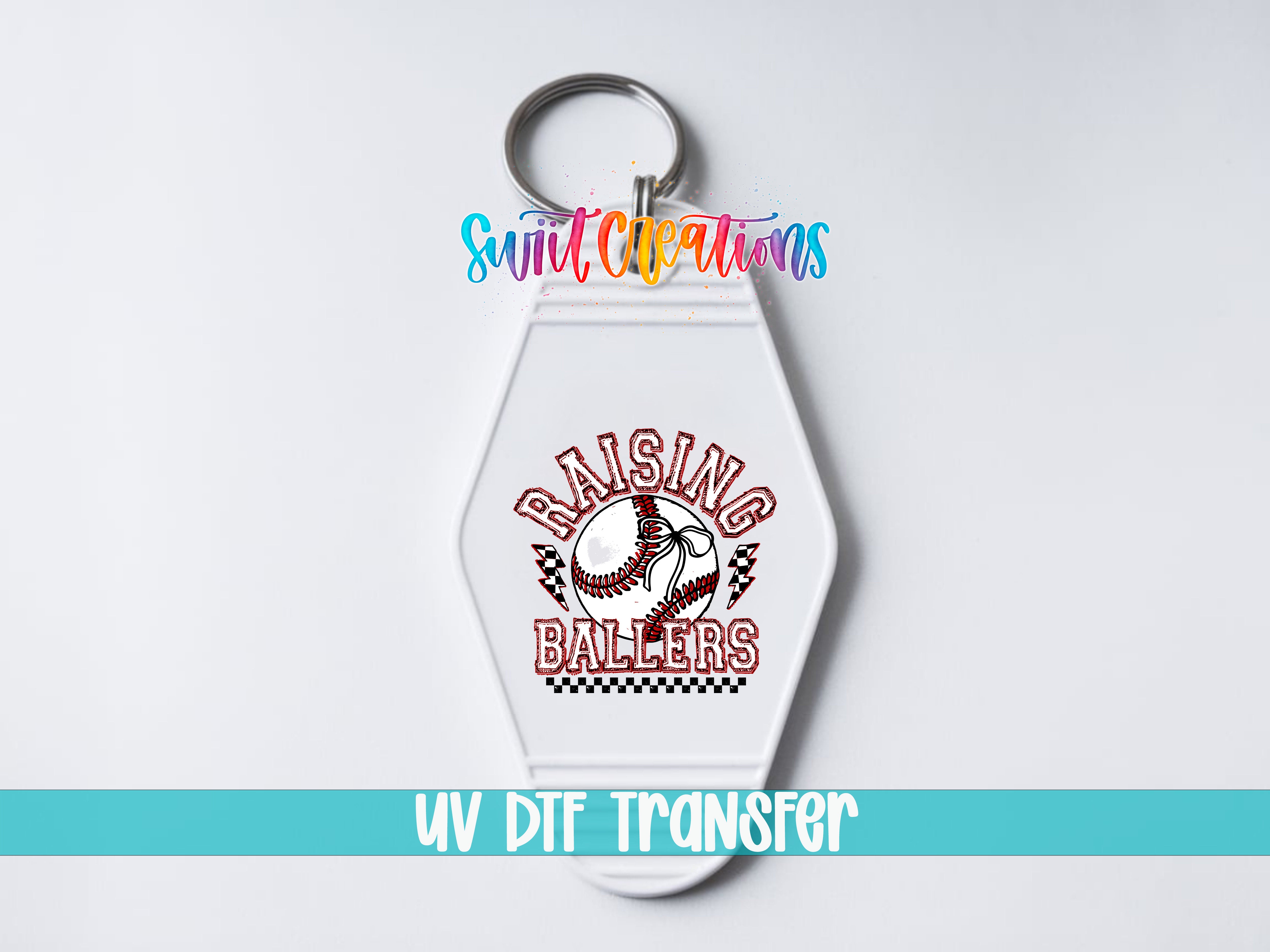 A keychain with a baseball design and the text "RAISING BALLERS" printed on it.